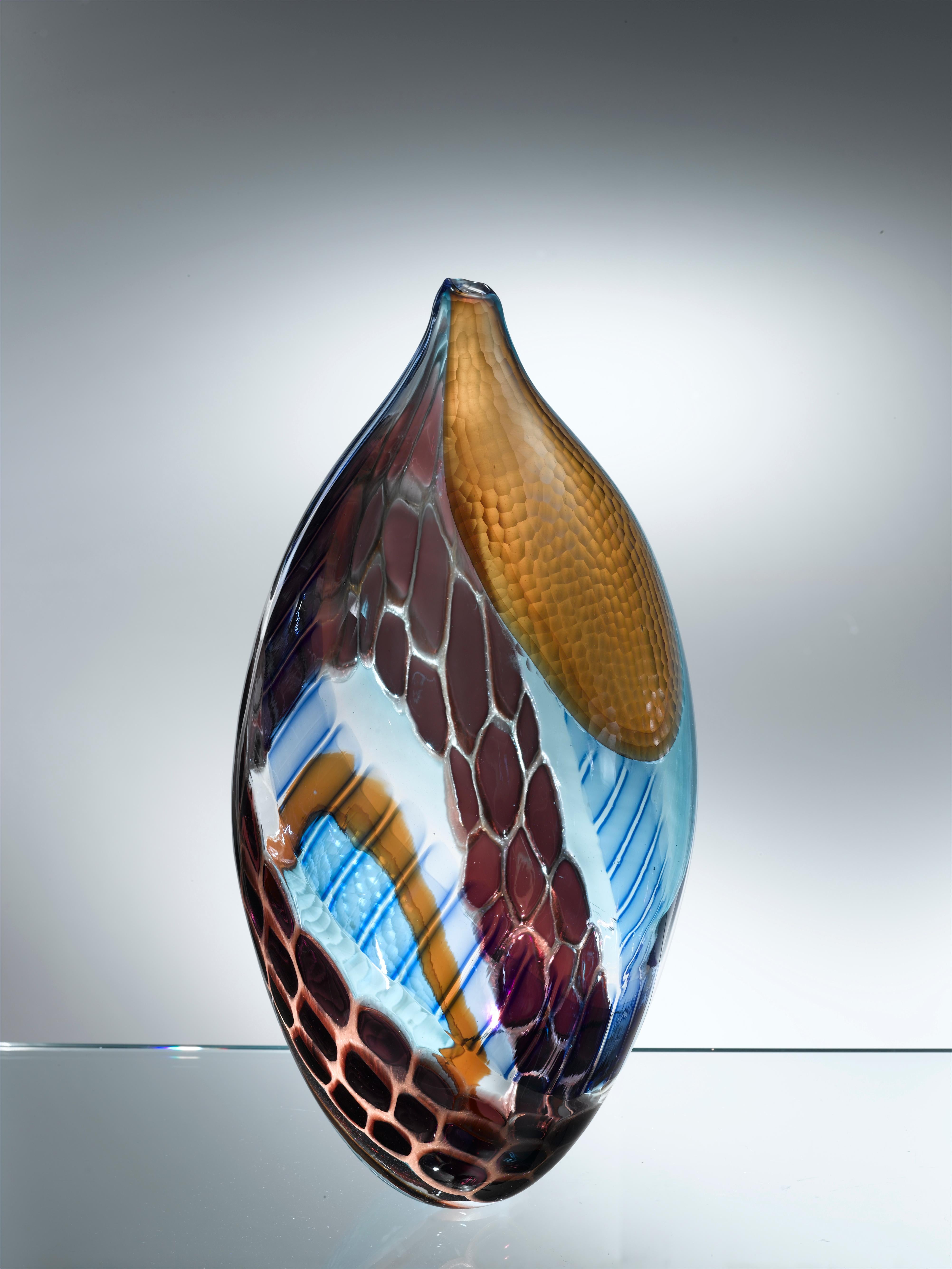 Murano artistic glass. The Murano artistic glass sculpture is a creative and natural expression of the artist Eros Raffael, made of Murano blown glass by Eros Raffael, in this sculpture they are enclosed in perfect regular shapes: the harmony, and
