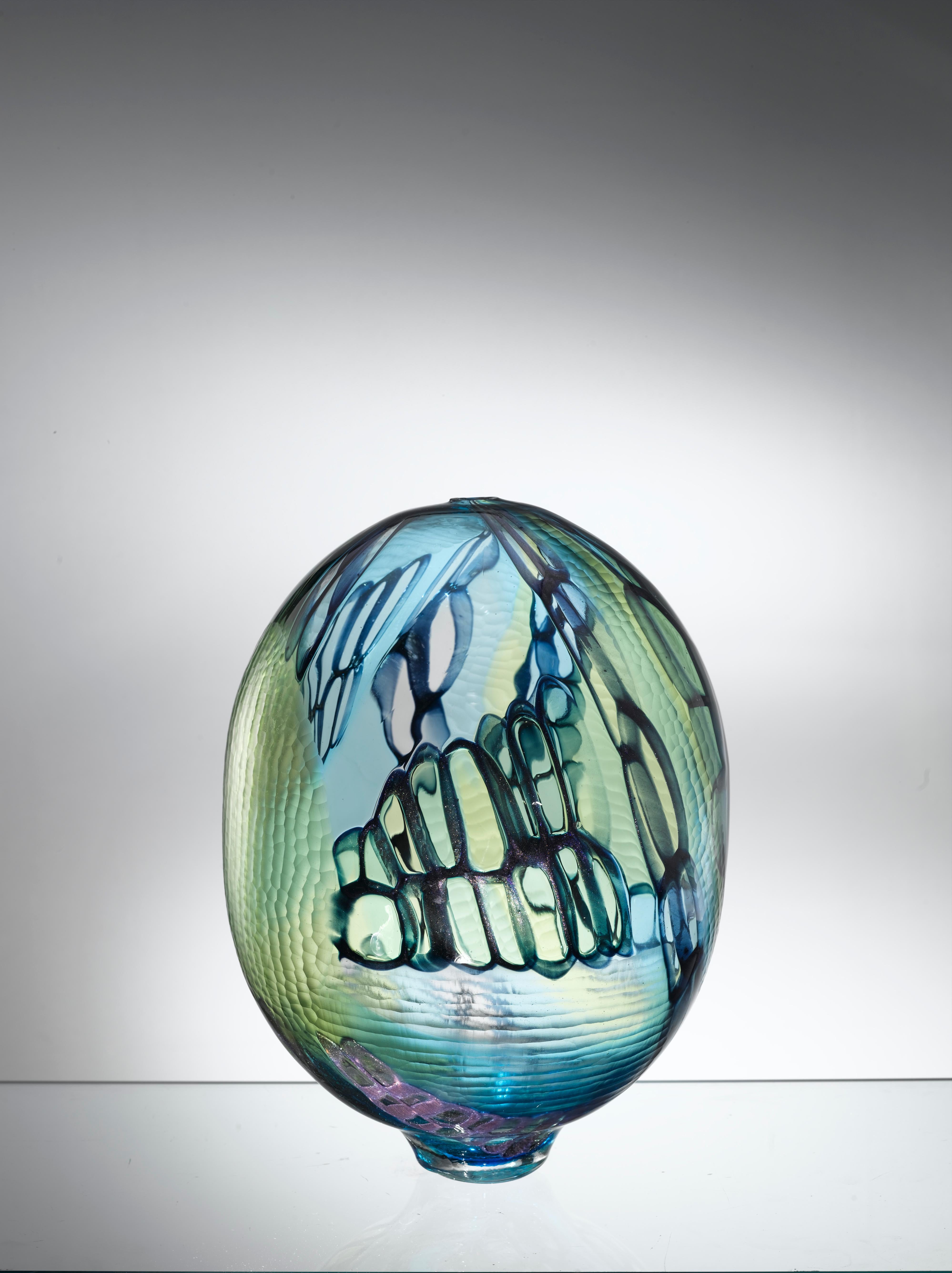 Murano artistic glass. The Murano artistic glass sculpture is a creative and natural expression of the artist Eros Raffael, made of Murano blown glass by Eros Raffael, in this sculpture they are enclosed in perfect regular shapes: the harmony, and