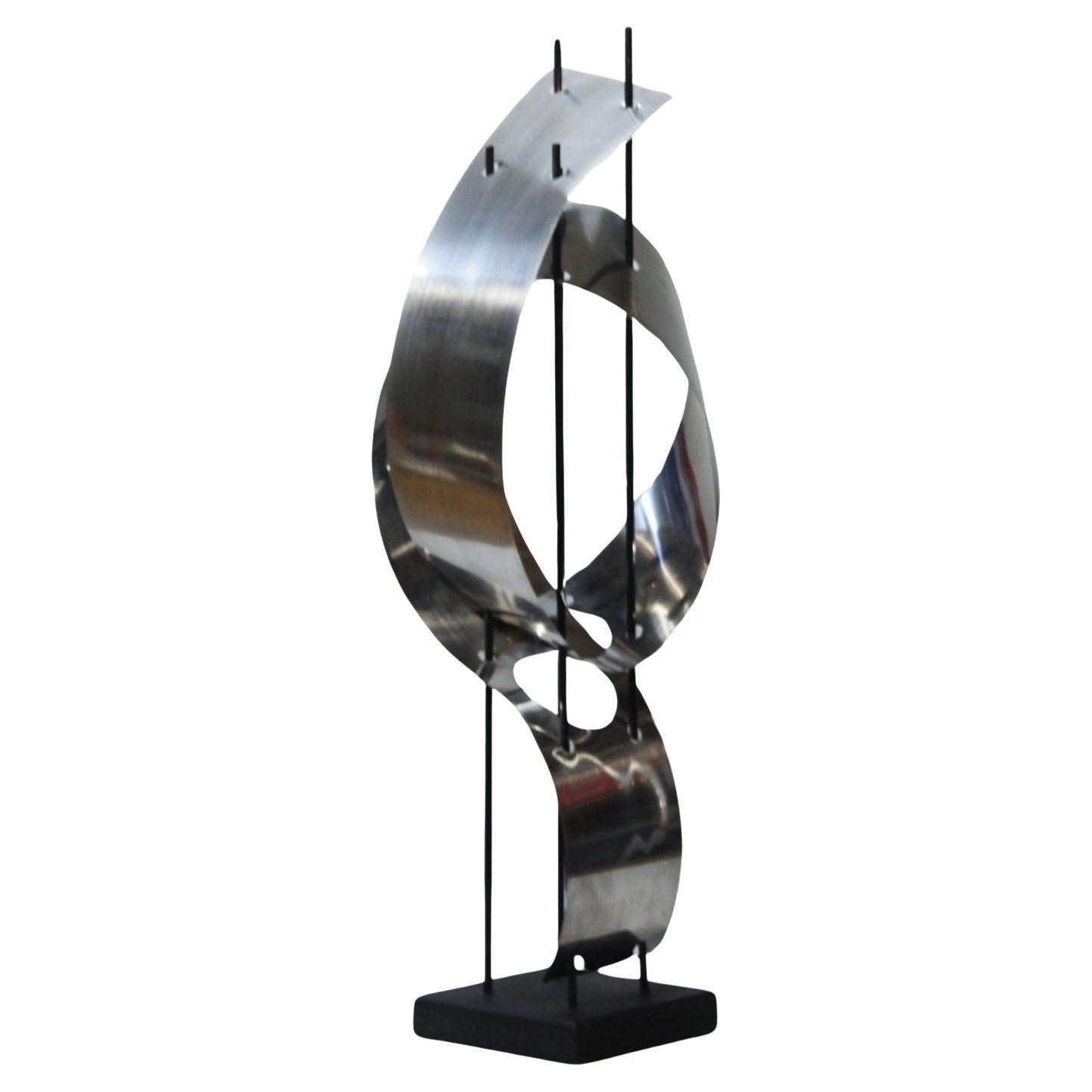Abstract space Age sculpture in sheet metal on wooden base, France 1970s For Sale
