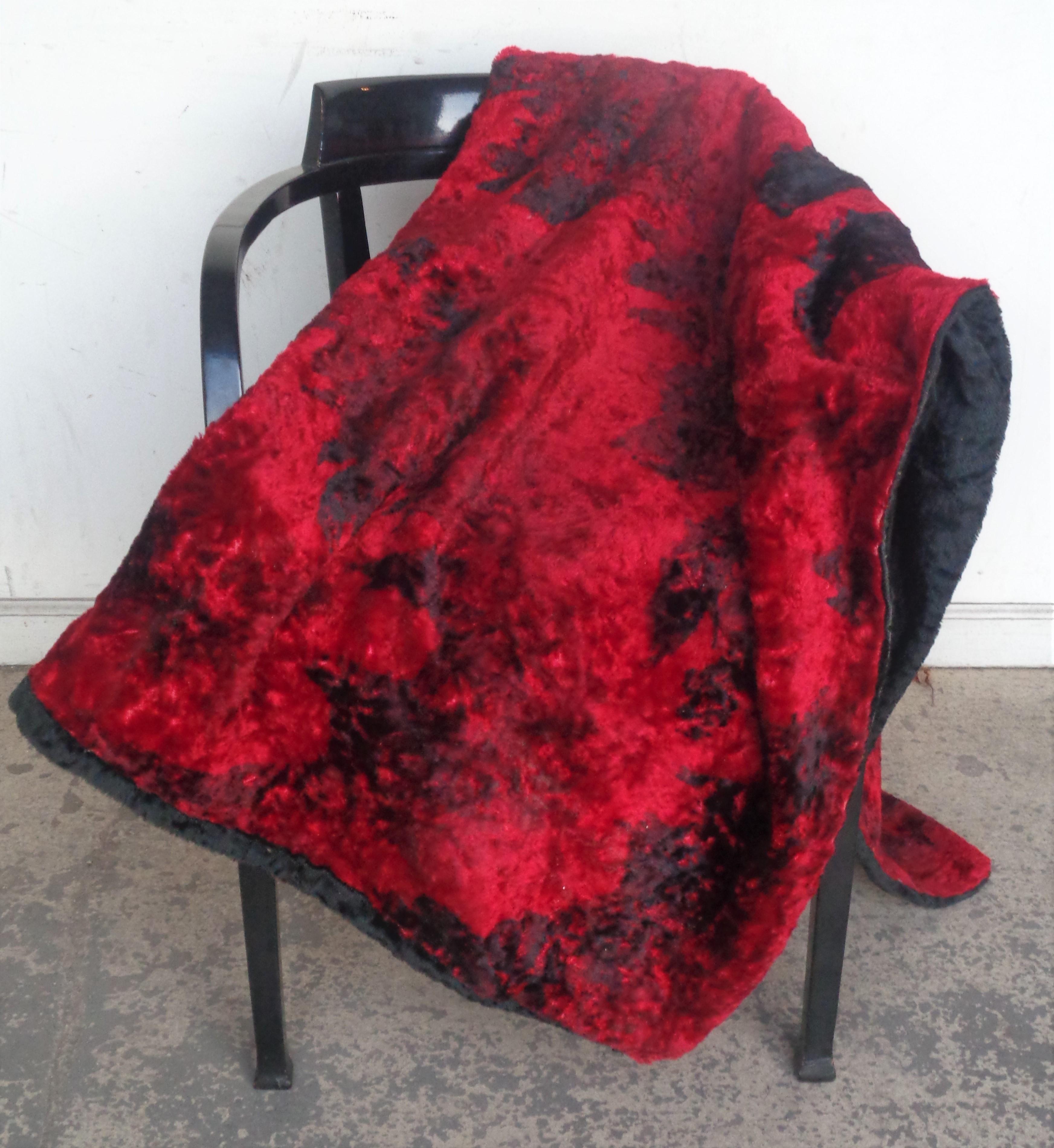 Unusual red and black abstract splotch design hand stitched mohair wool sofa chair furniture throw blanket. Reverse side is black. Soft thick textured lush supple wool with a beautiful sheen. Measures 64 inches by 48 inches and approximately 1 inch