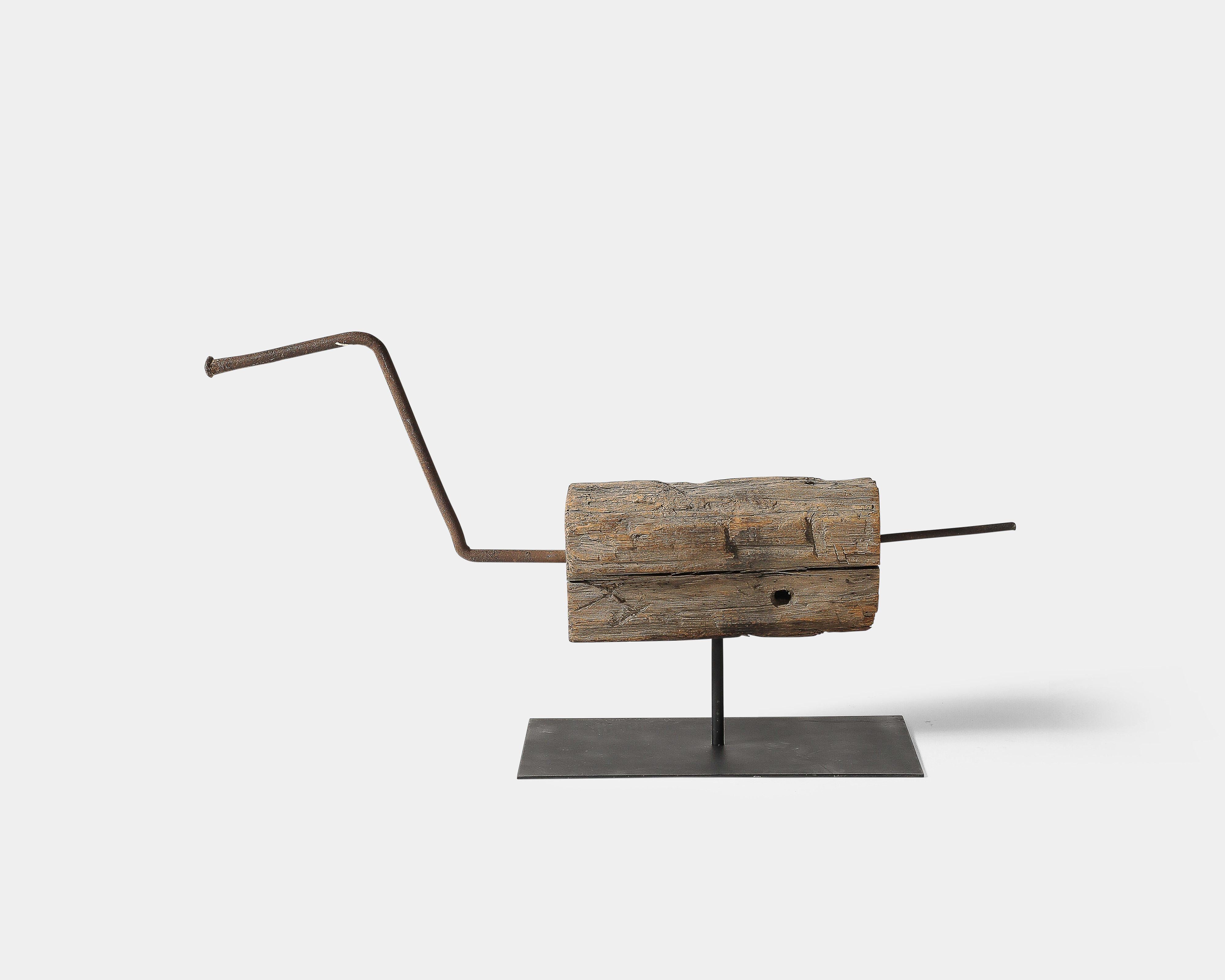 Minimalist steel and wood sculpture.