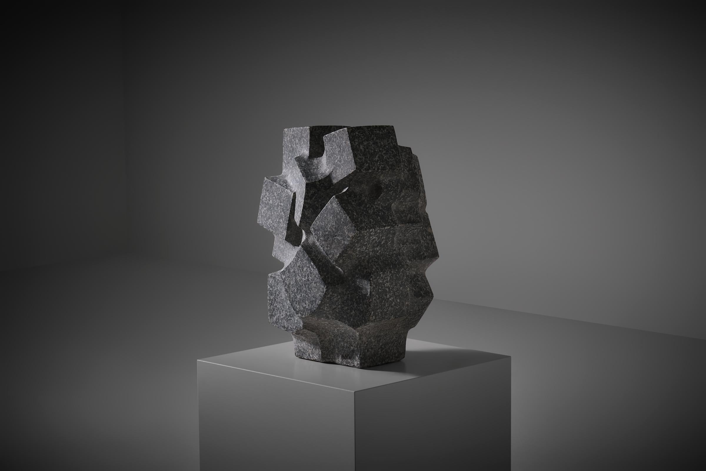 Abstract stone sculpture ‘Metropolis 4’ by Vittorio di Muzio (1924 - 2014), Italy 1986. Di Muzio studied sculpture at the l’Accademia delle Belle Arti di Brera in Milan and was trained by Maestro Marino Marini, he graduated in 1958. This work is