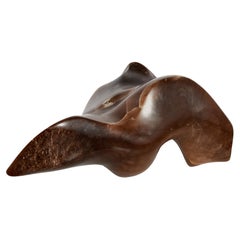 Abstract stone sculpture with reclining form
