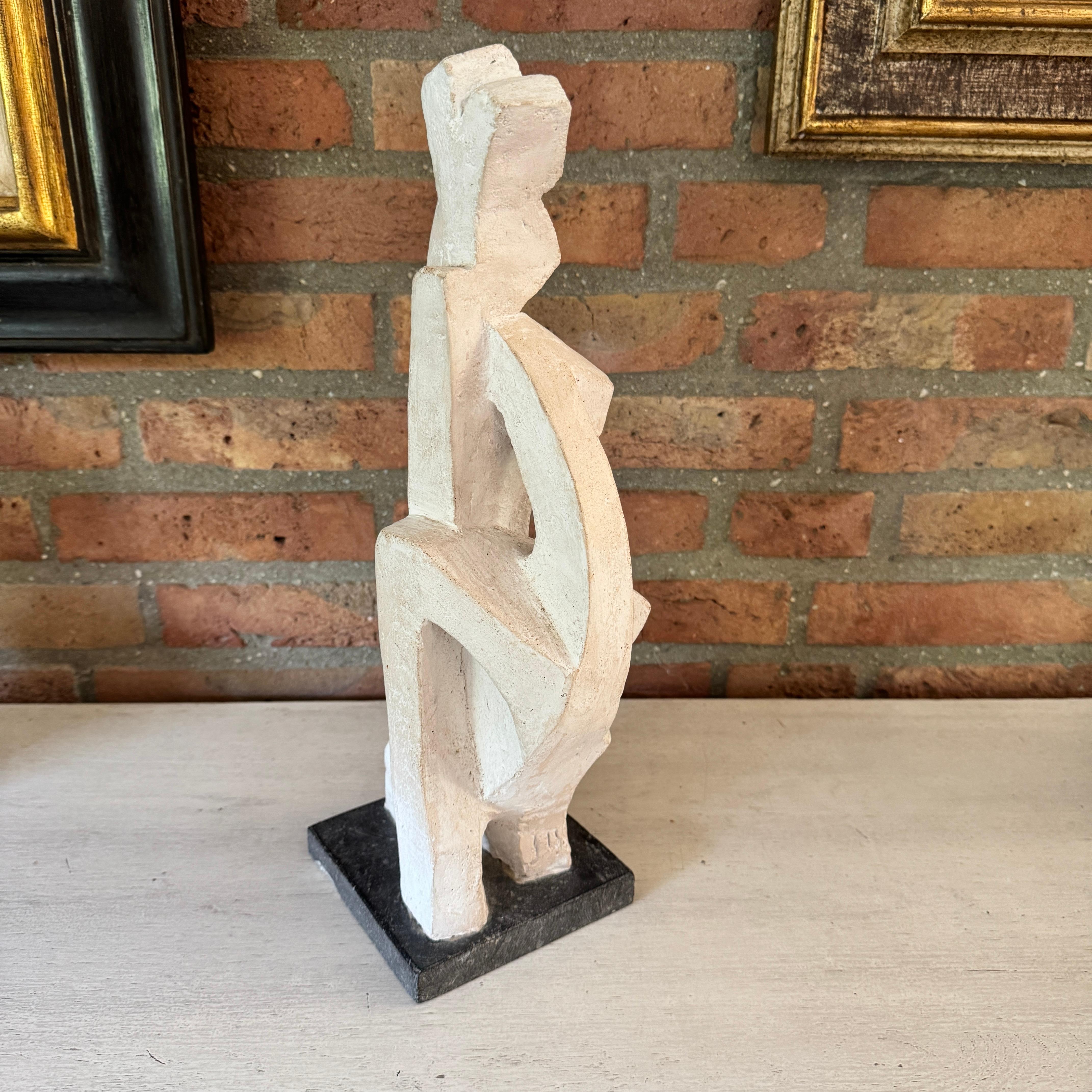 Well sized stone abstract sculpture of a female form very much in the vein of the work of Oscar Jespers or Alexander Archipenko. 

It is signed J.O. 

Clearly the work of a very accomplished sculptor. 

Its form is very tactile and it will make an