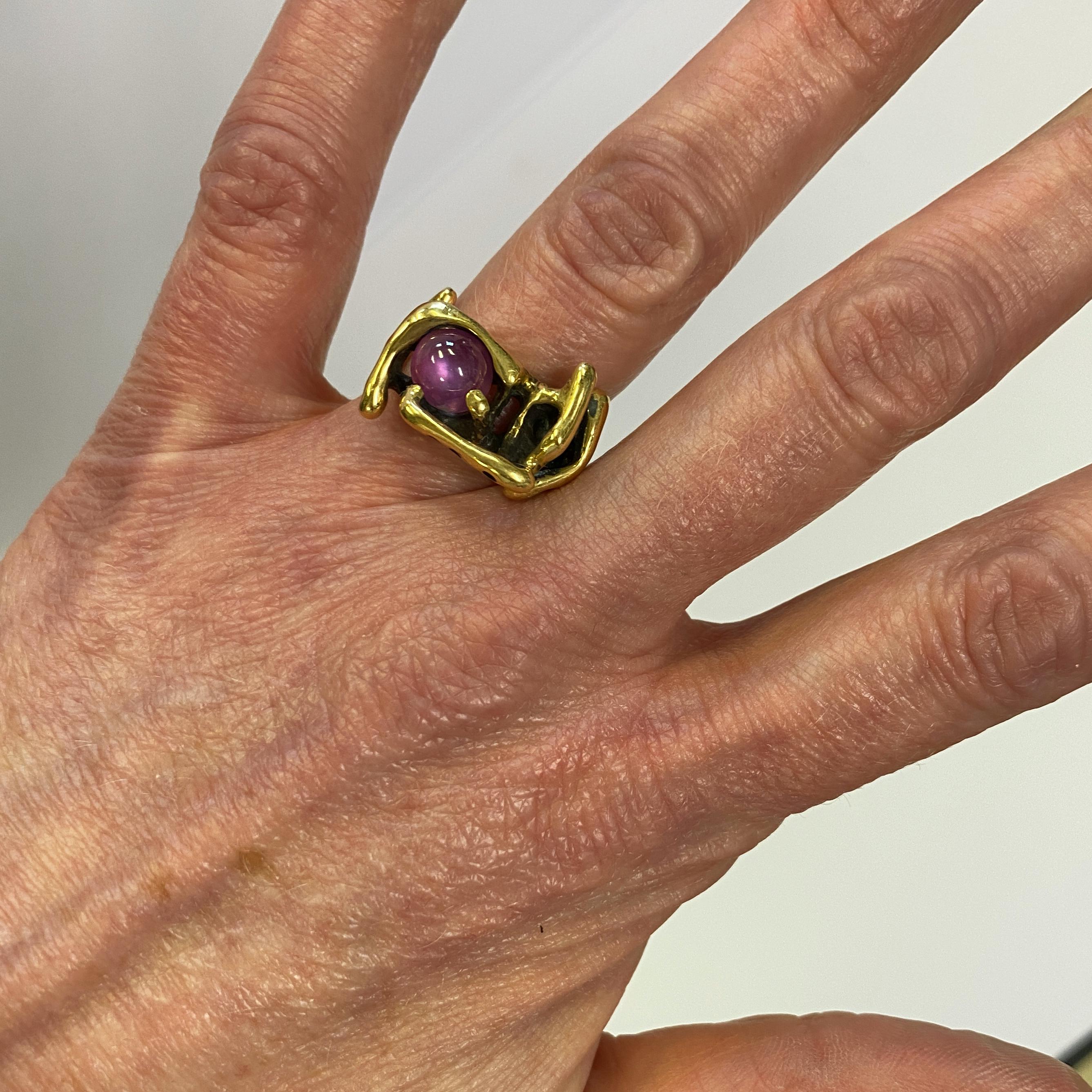 We think whoever made this unsigned studio ring was probably inspired by the work of Bob Winston, the eccentric mid-century Northern California modern jeweler and sculptor.  It features a high-dome natural ruby cabochon (approximately 3.5 carats)