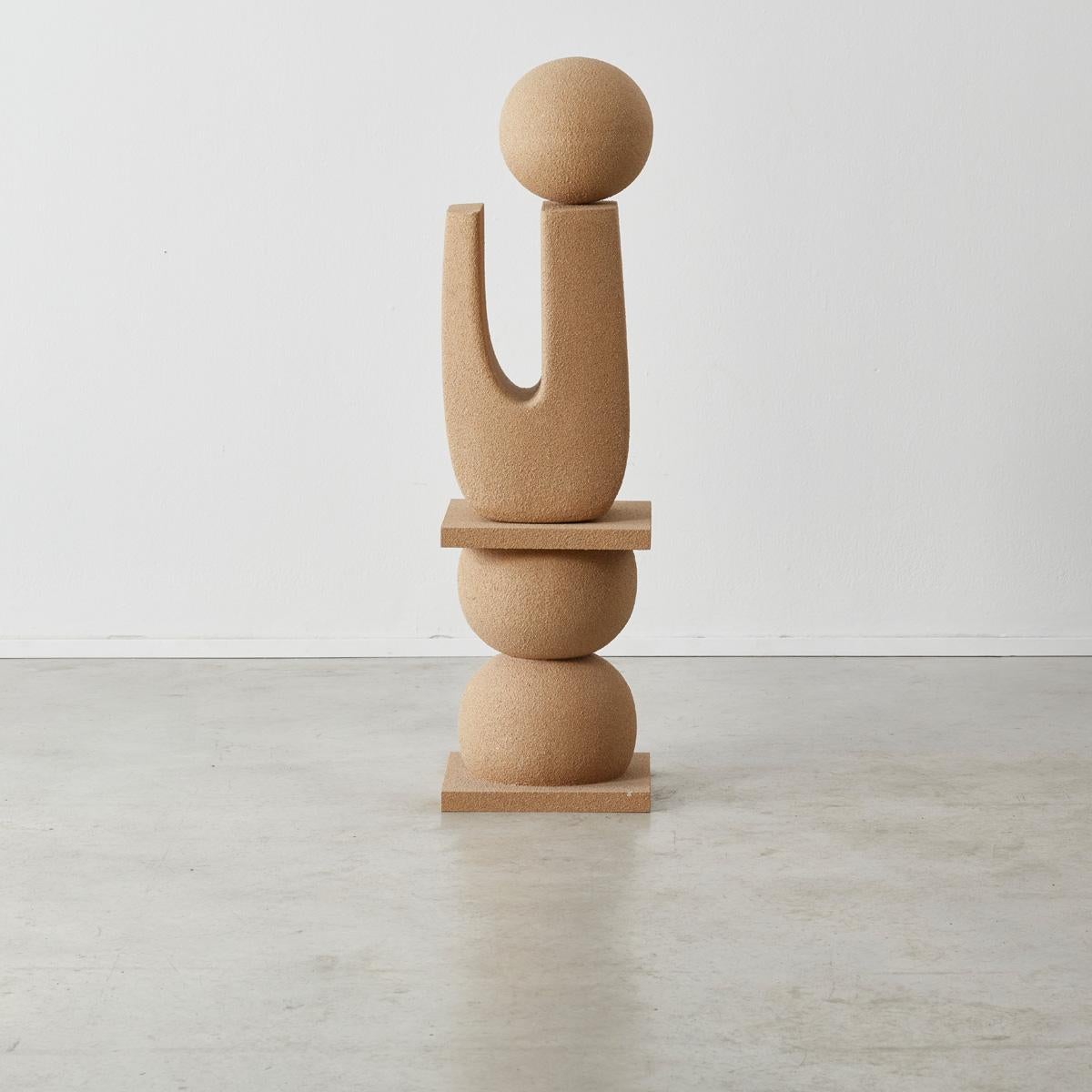 An abstract sculptural work comprised of stacked abstract shapes that appear to balance on top of each other. The surface is made of resin and sand creating a sandstone like texture without the weight. 

This totem sculpture makes the perfect