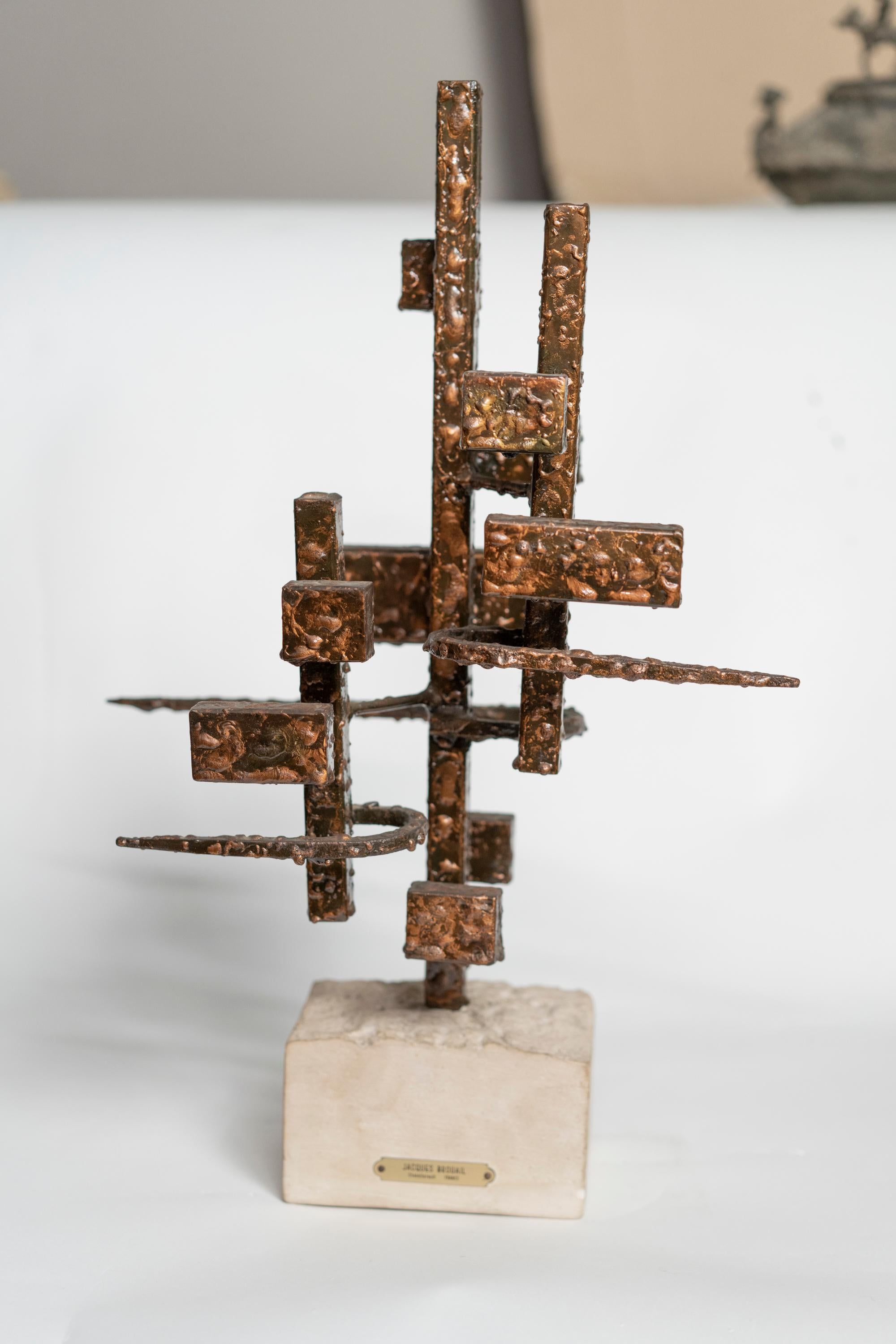 Abstract welded steel by Jacques Brouail, resting on stone base
Signed on brass plaque 