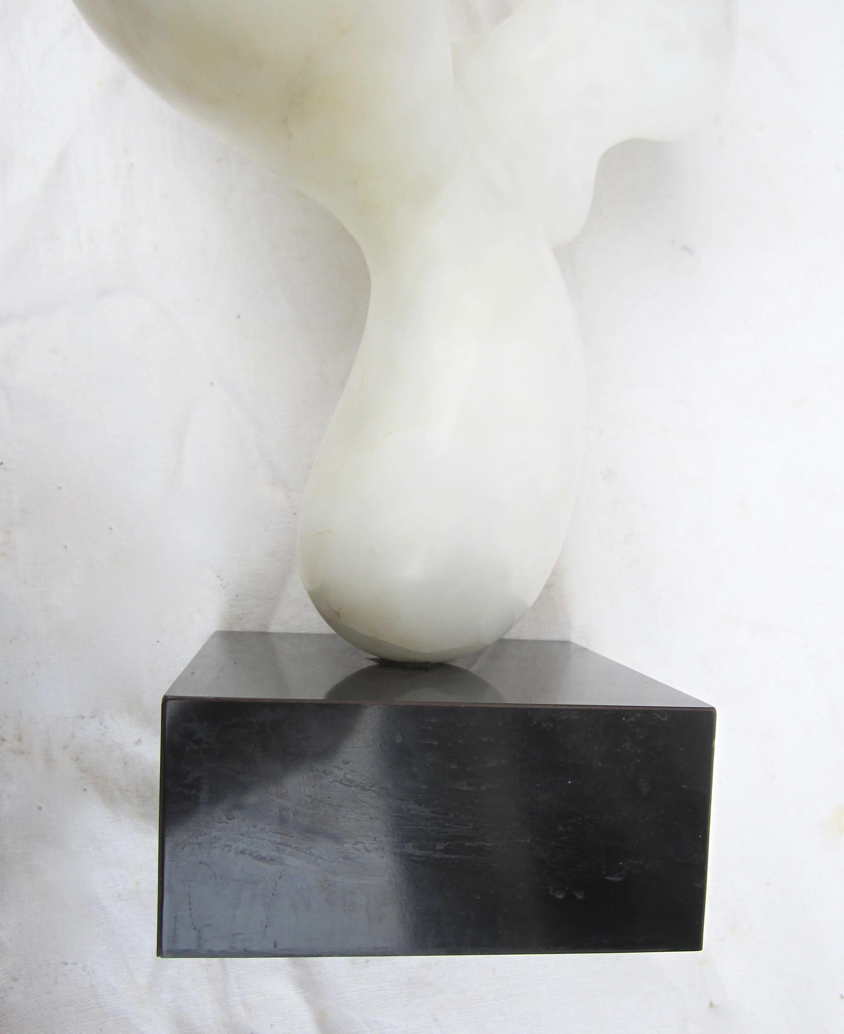 Abstract white marble sculpture on black swivel base

Base measures: 5.5