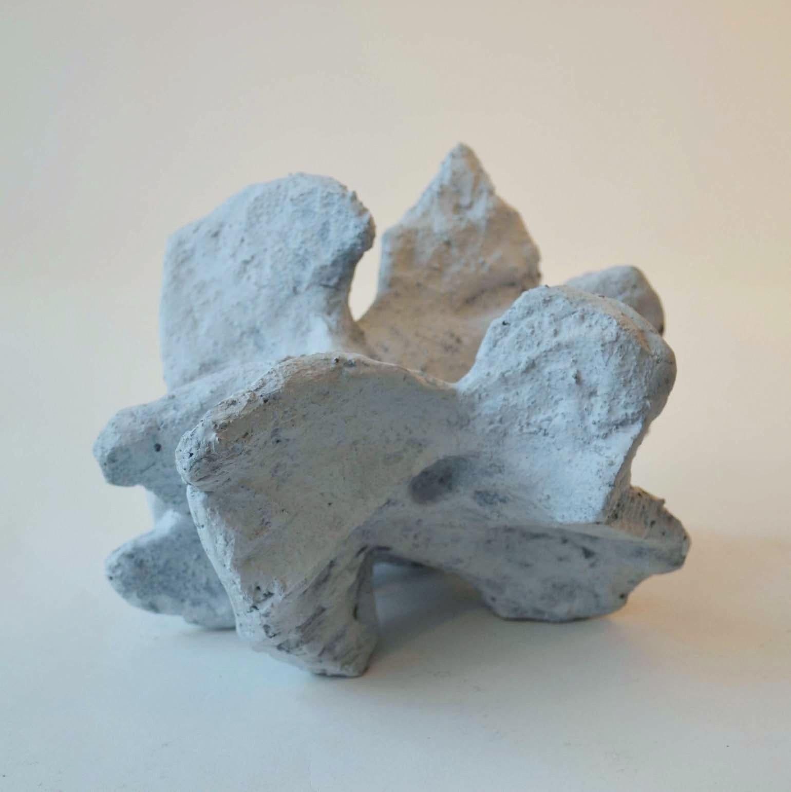 Set of three small abstract white rock sculpture are hand sculpted in ceramic. The sculptures resemble white cliffs on the British coast line. They are chalk-white washed after firing.
Bryan Blow's work echoes a voyage of discovery in not just the