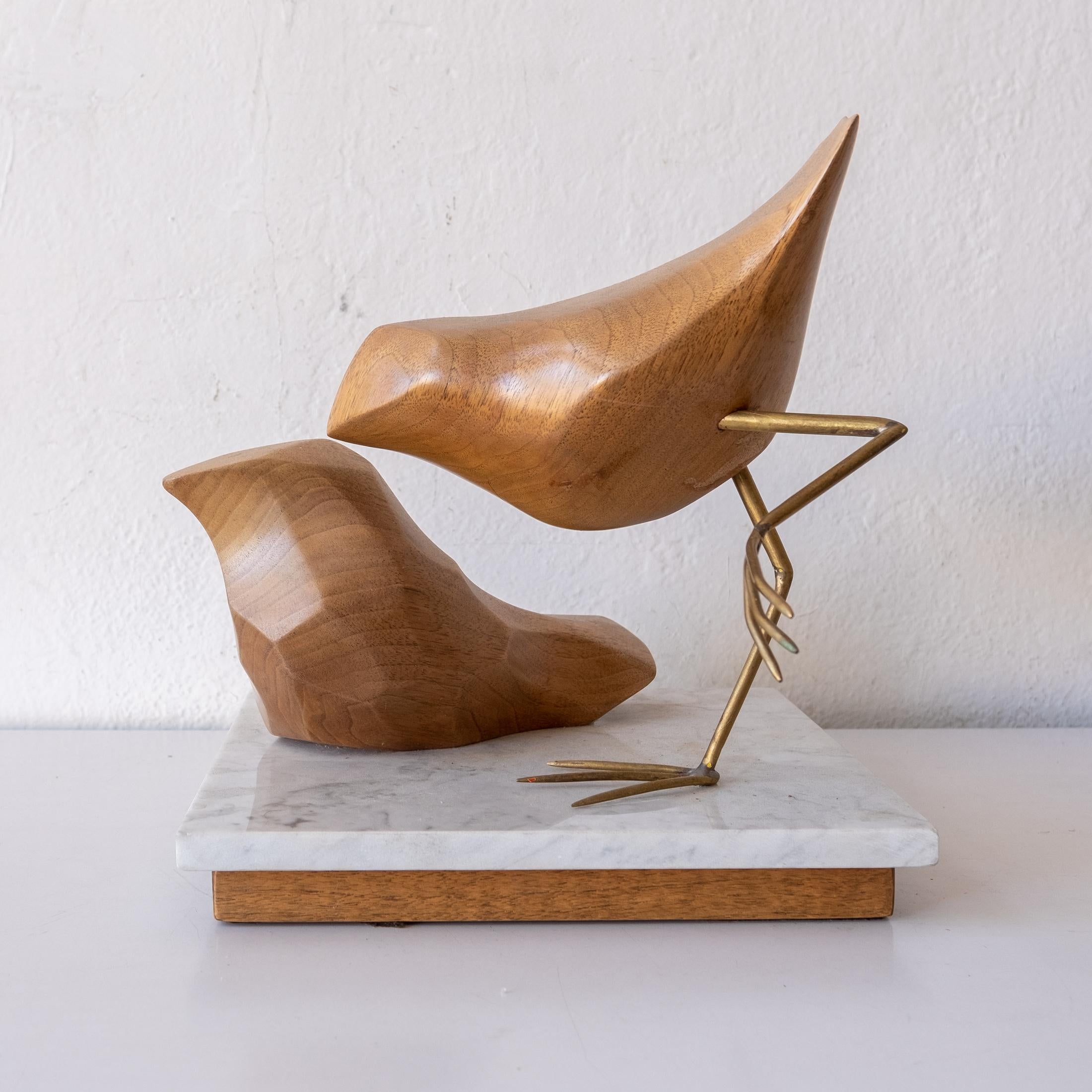 Abstract bird sculpture by artist Val Robbins (1925-2009). Executed at his Rimrock Pennsylvania studio. Wood forms on metal legs, with a marble and wood base. The piece was purchased directly from the artist's estate. Signed on the base. USA,