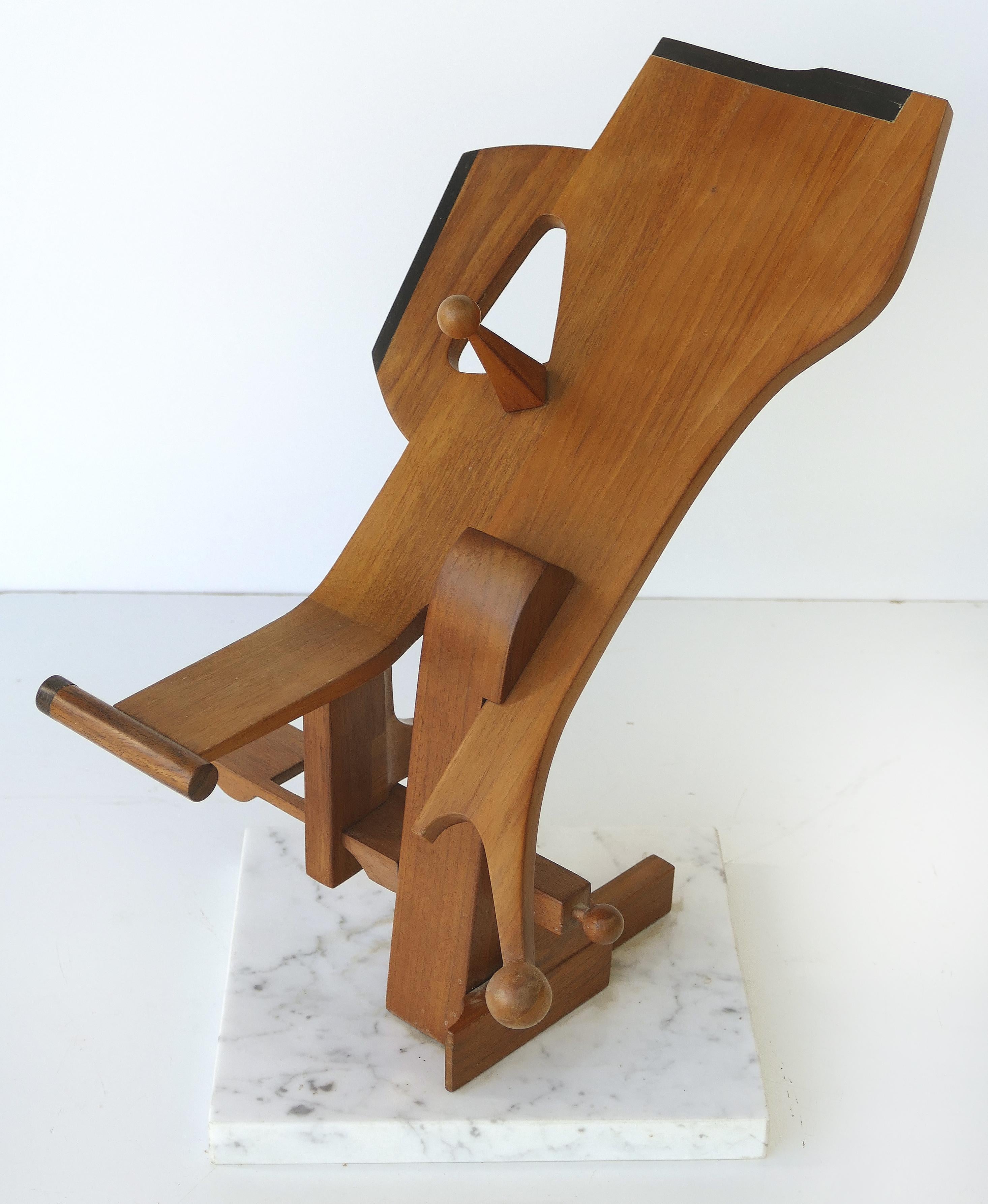 Abstract wood Brutalist sculpture, manner of Leo Amino

Offered for sale is an abstract Brutalist wood sculpture with architectural inspiration created in the manner of Leo Amino. The sculpture is viewed in the round and mounted on a marble base.