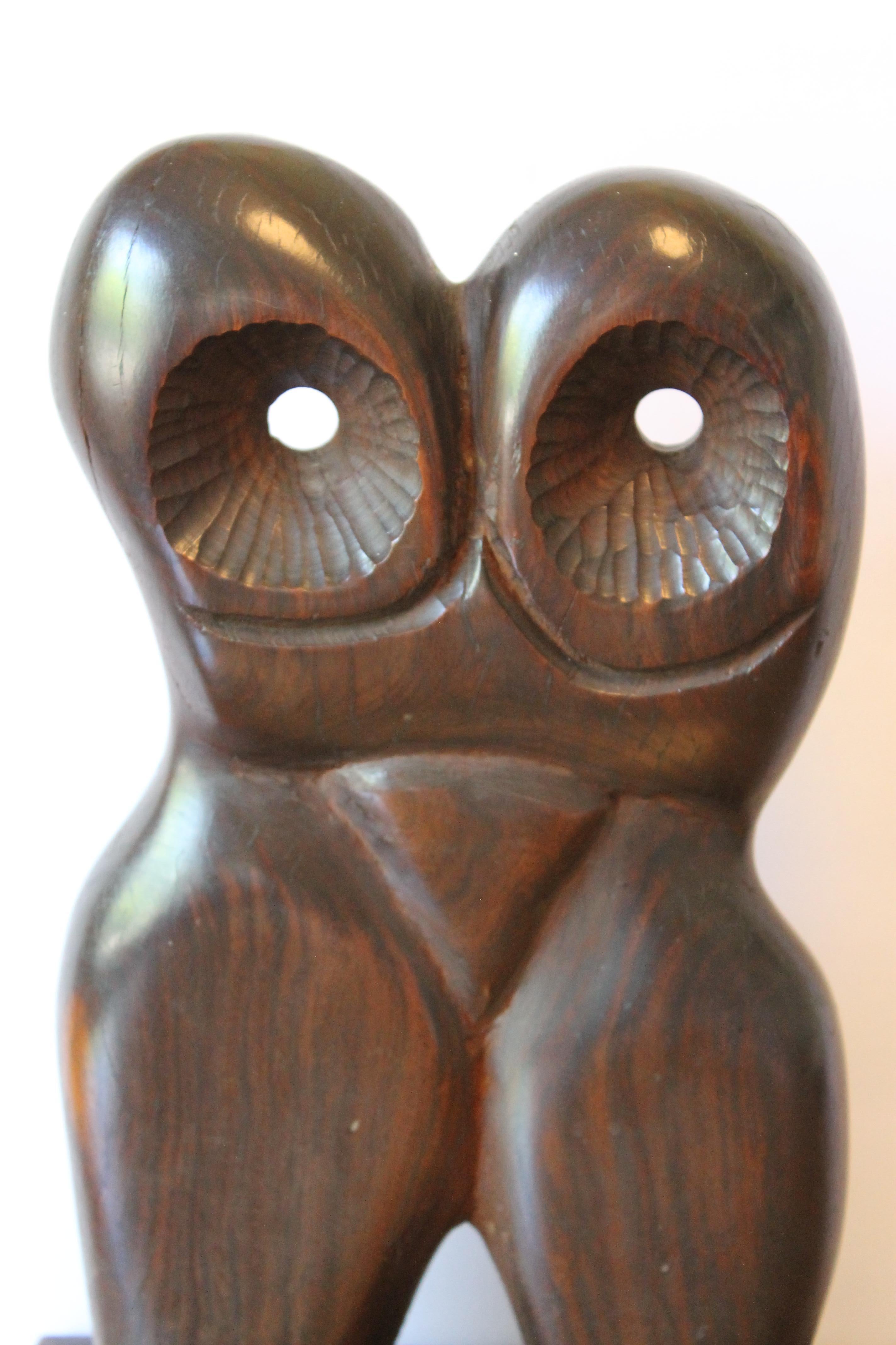 Abstract wood sculpture.  We believe the wood to be Ironwood.  Sculpture on base measures 13.25