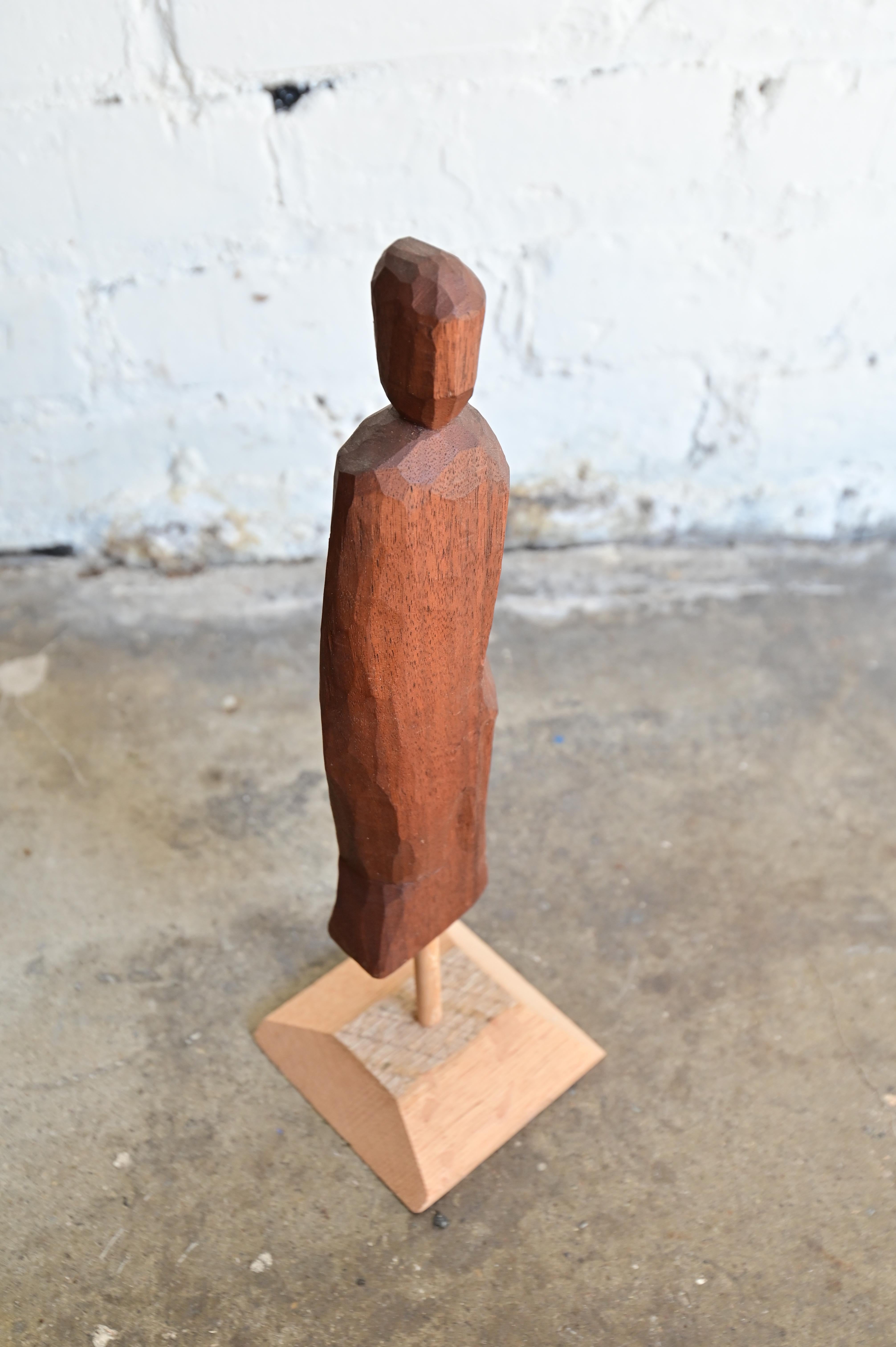 Unique hand carved abstract human figure on stand. Walnut wood. New item never formerly owned. Measures 13