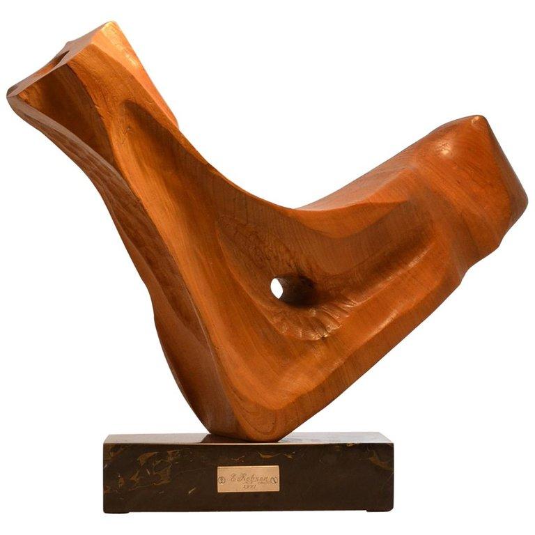 Dynamic abstract oak wooden sculpture with organic finish on a black and gold marble plinth, hand-carved and signed by E. Robson 1971, England.


 