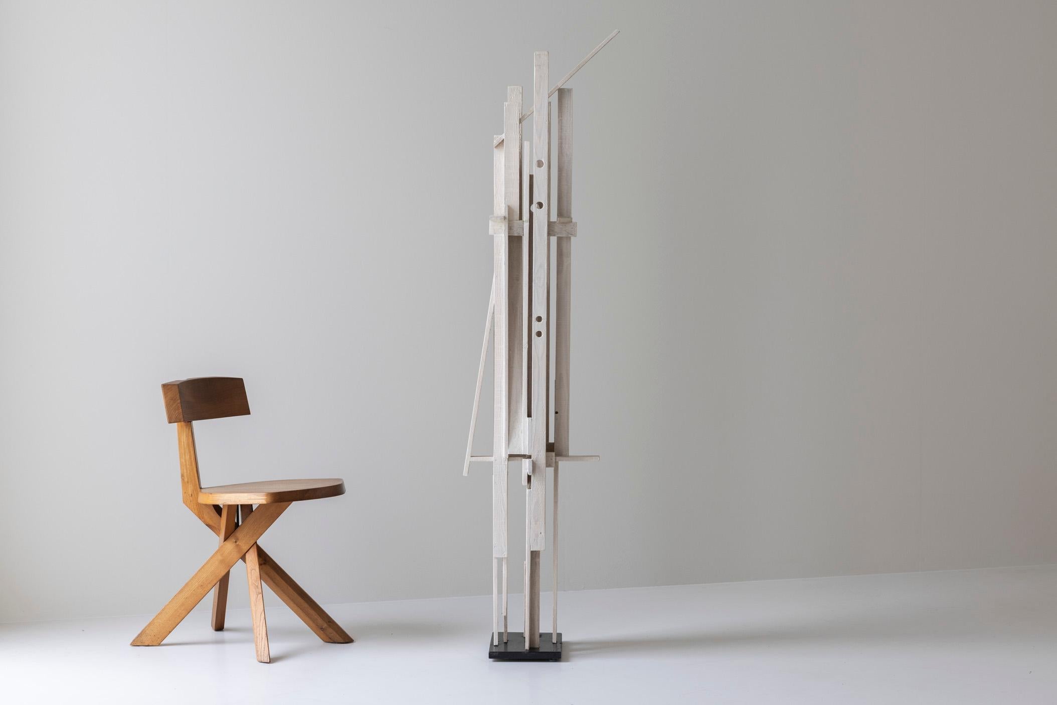 Step into the elegance of mid-century design with this striking wooden sculpture by R. Ditmarch, created in the Netherlands during the 1970s. A true embodiment of the era’s passion for clean lines, organic forms, and exceptional craftsmanship, this