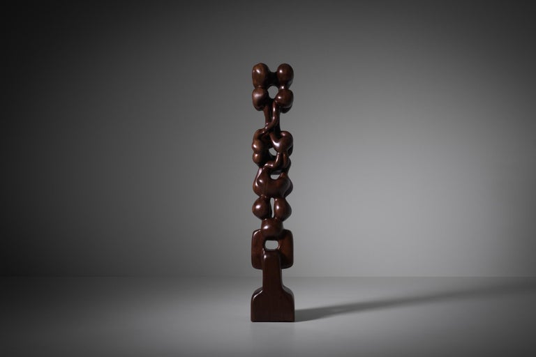 Abstract wooden totem sculpture by R. van 't Zelfde (The Hague 1949), the Netherlands 1970s. Van 't Zelfde studied at the Academy of fine arts in The Hague. The sculpture is hand-carved out of one piece of solid Azobé wood. Very strong and