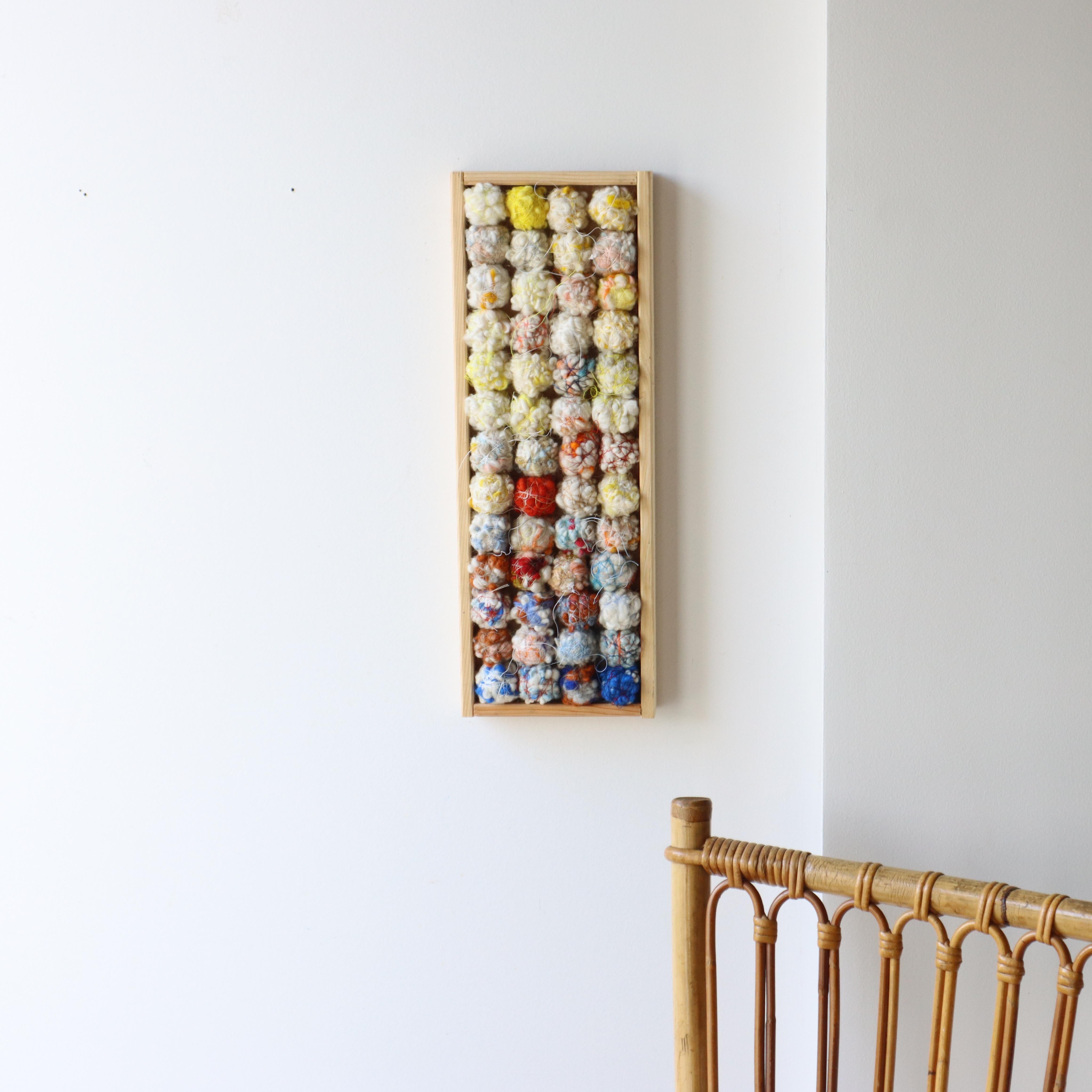 Woolen Color studies in a recycled box
Hand-spun woolen balls - gradient - wrapped in silk and cotton yarn
Handmade, hand-spun wool objects in an old box
Soft balls and shapes of wool held together by fine cotton and silk yarn
A fascinating