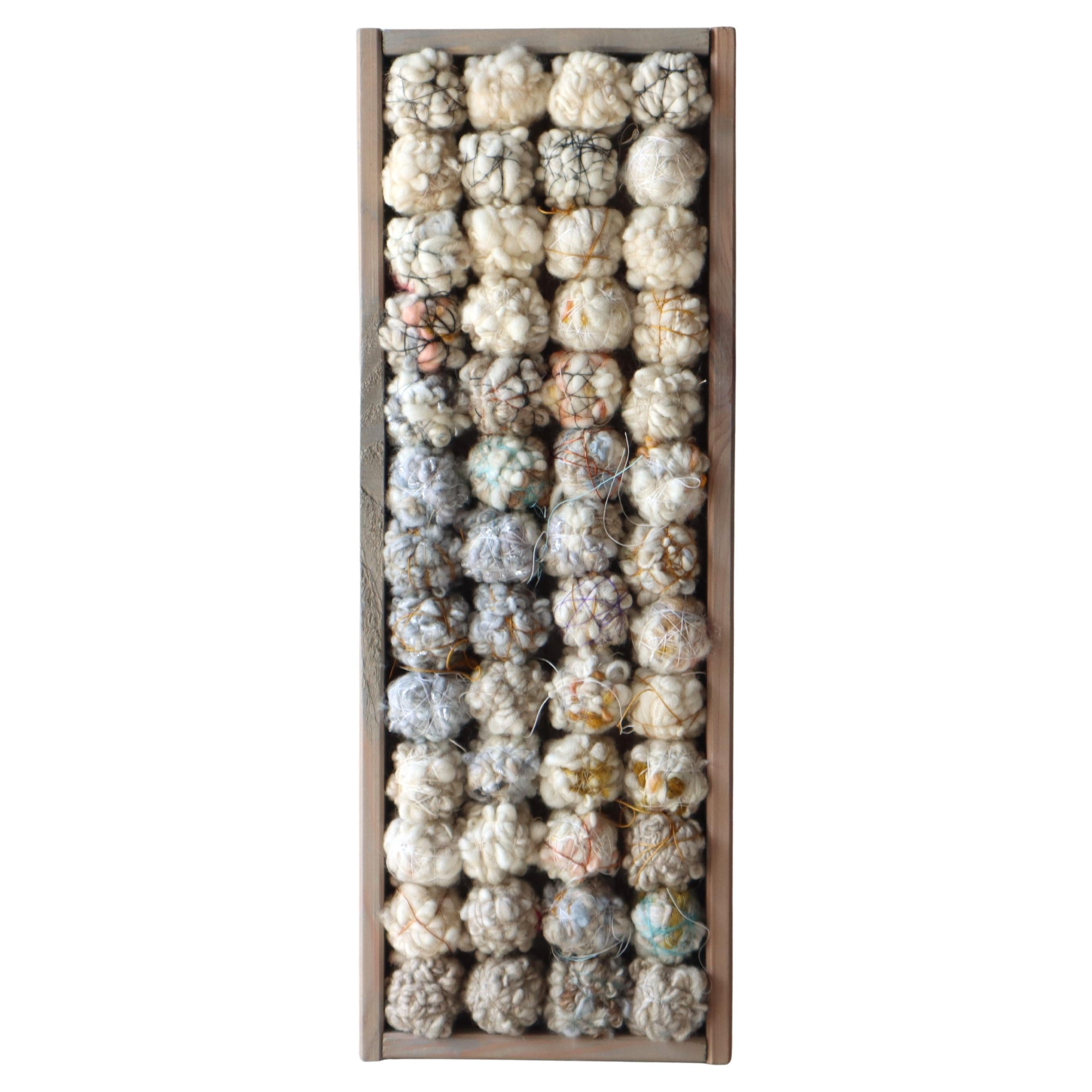Woolen Color studies in a recycled box
Hand-spun woolen balls - gradient - wrapped in silk and cotton yarn
Handmade, hand-spun wool objects in an old box
Soft balls and shapes of wool held together by fine cotton and silk yarn
A fascinating