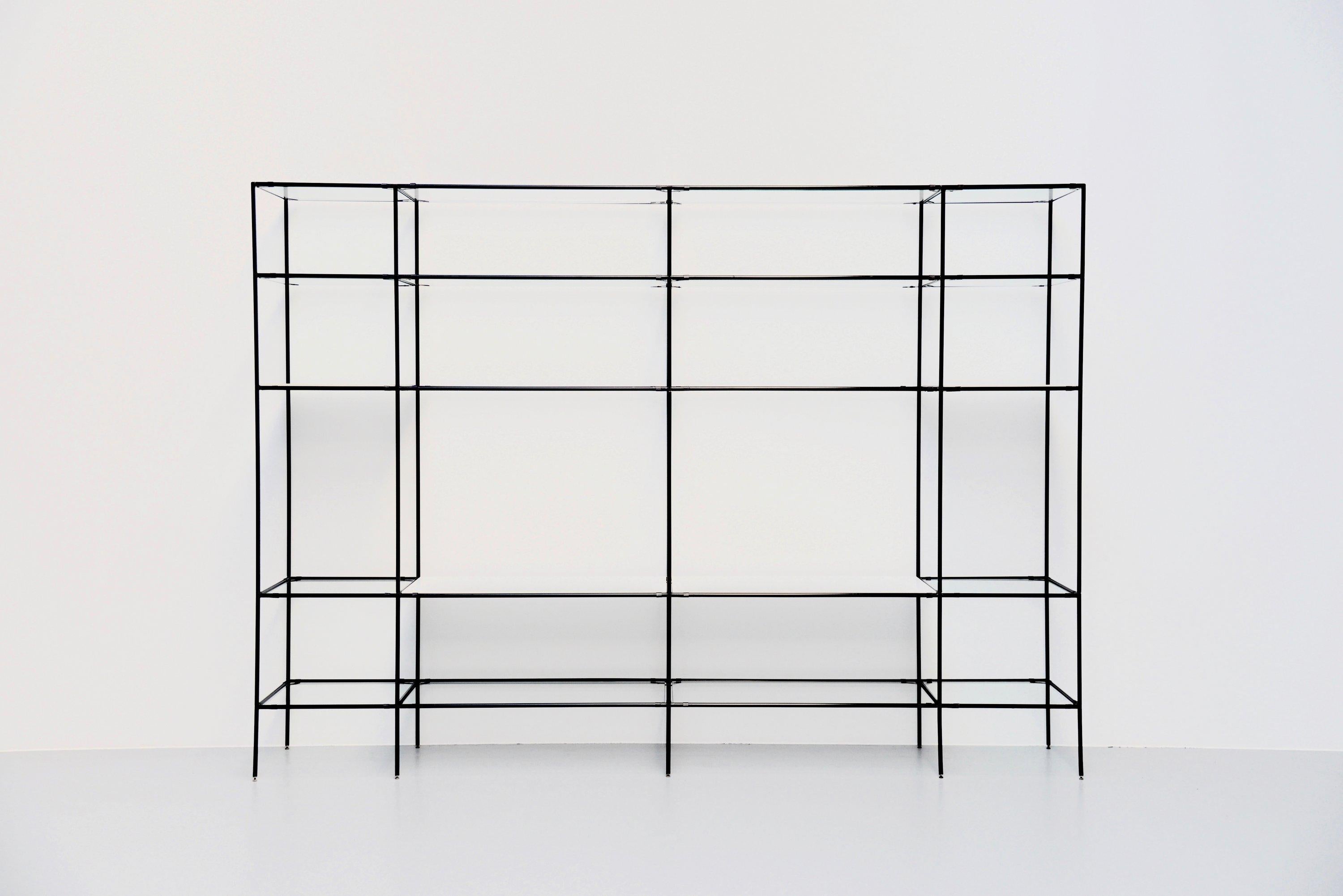 Very nice large modernist shaped so called 'Abstracta' shelving unit designed by Poul Cadovius and manufactured by Royal System, Denmark, 1960. This timeless system exists of black lacquered metal tubes with metal connectors, clear glass shelves in