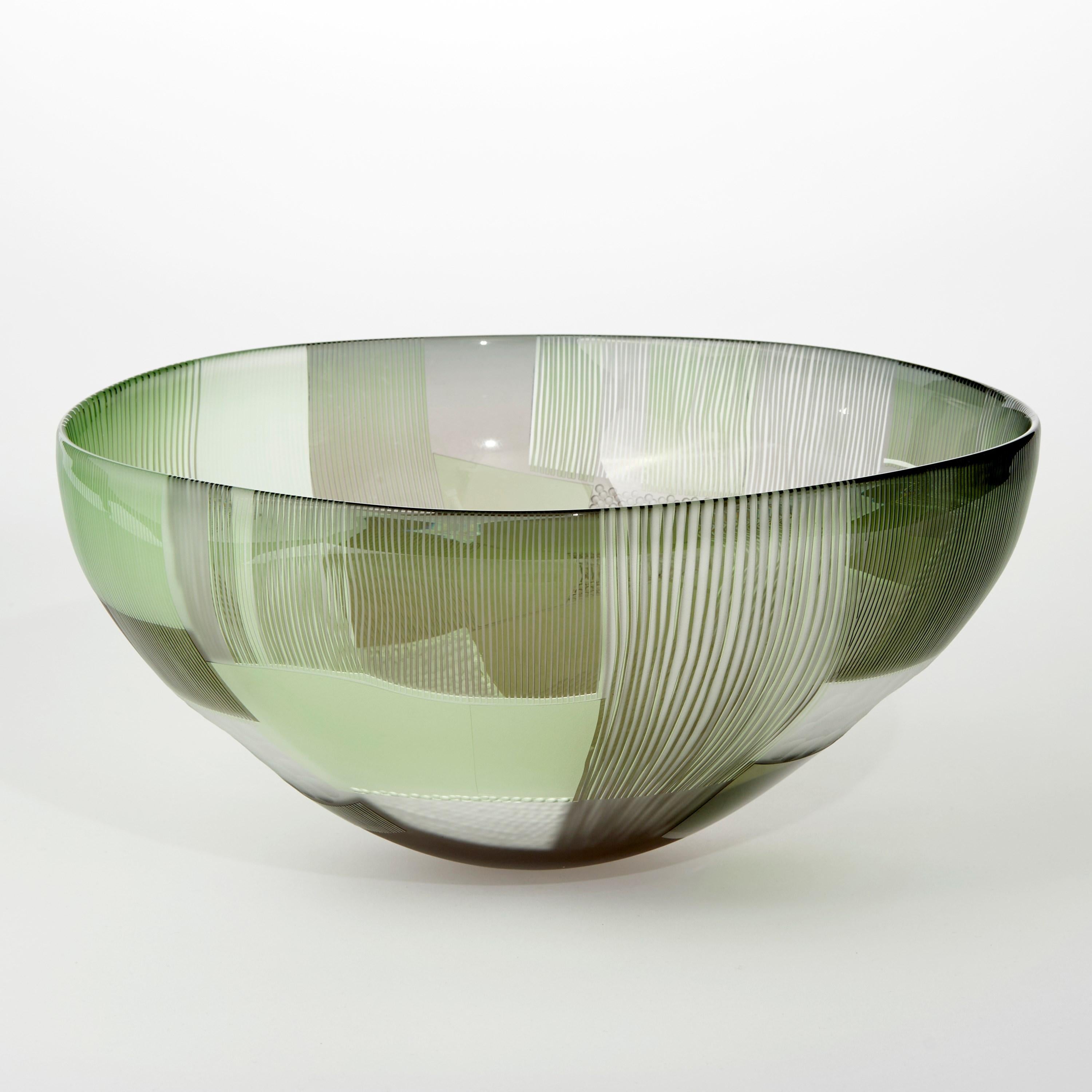 'Abstracted Land Grey Sky over Moss Green' is a unique handblown and cut glass artwork by the British artist, Kate Jones of Gillies Jones.

In the artist's own words:

“This new body of work references both the evident structure of the landscape and