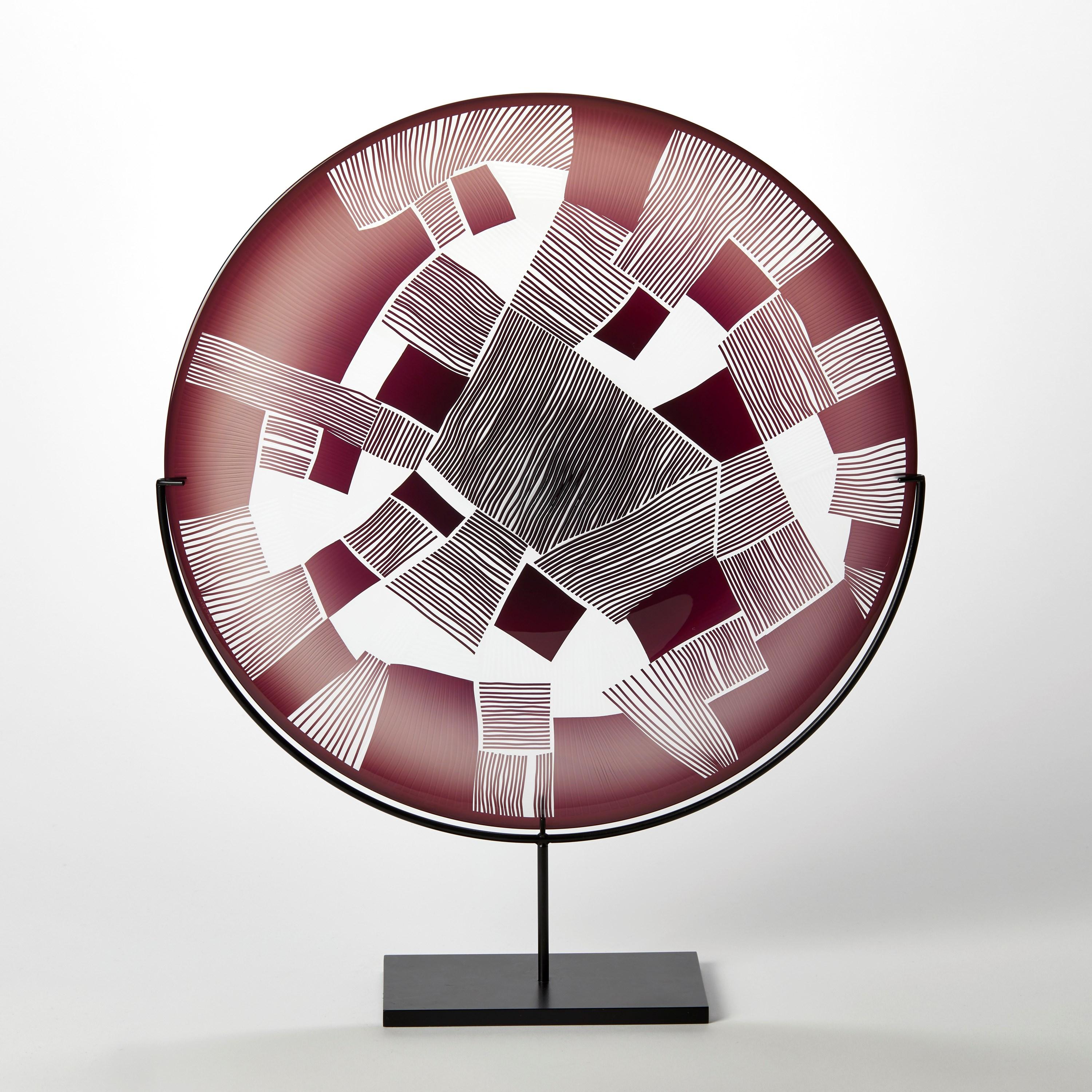 'Abstracted Land Ruby Red' is a unique handblown and cut glass artwork by the British artist, Kate Jones of Gillies Jones.

Created with Stephen Gillies, with whom Jones makes many works in collaboration, these exquisite sculptural plates are
