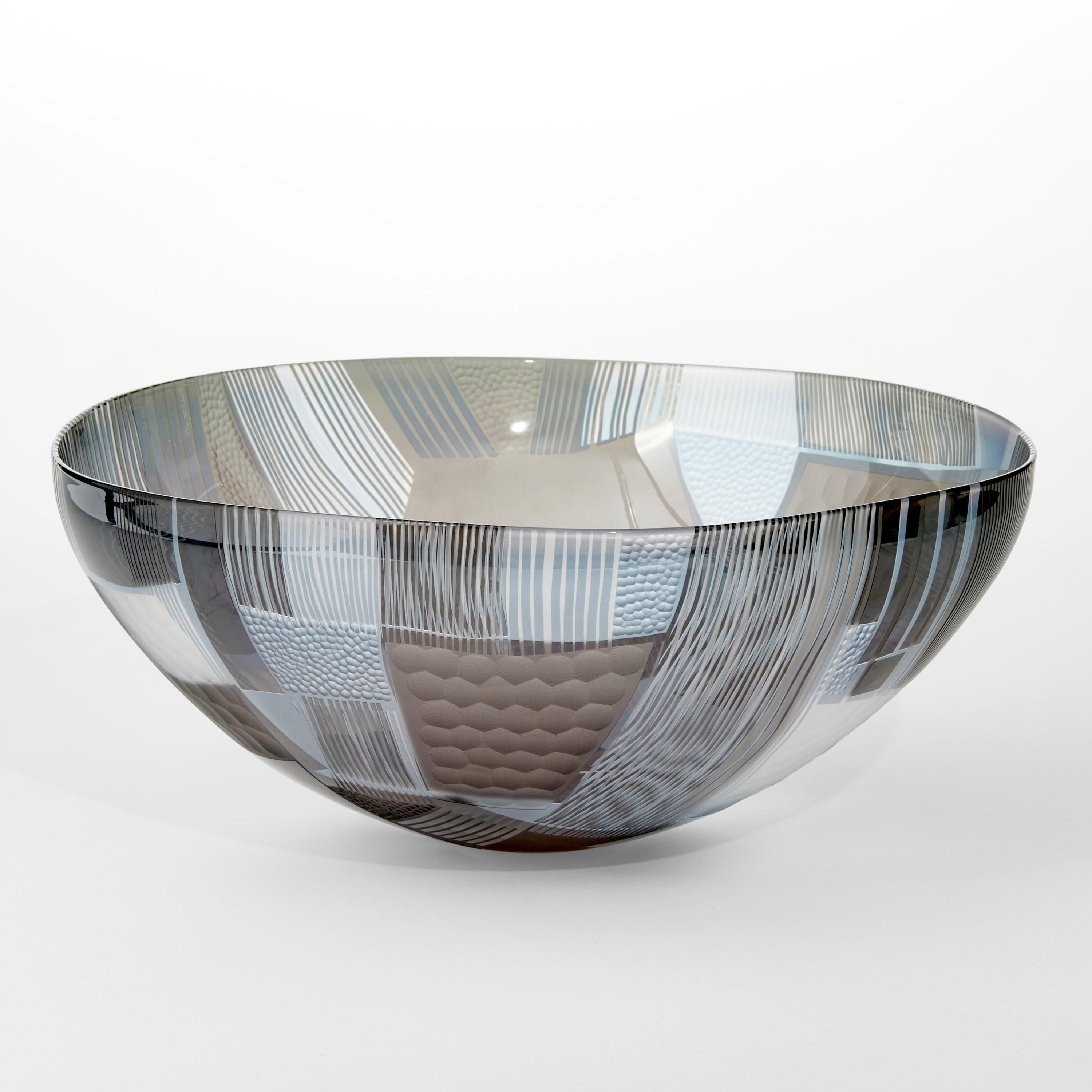 'Abstracted Land Winter Blue over Sky Grey' is a unique handblown and cut glass artwork by the British artist, Kate Jones of Gillies Jones.

In the artist's own words:

“This new body of work references both the evident structure of the landscape