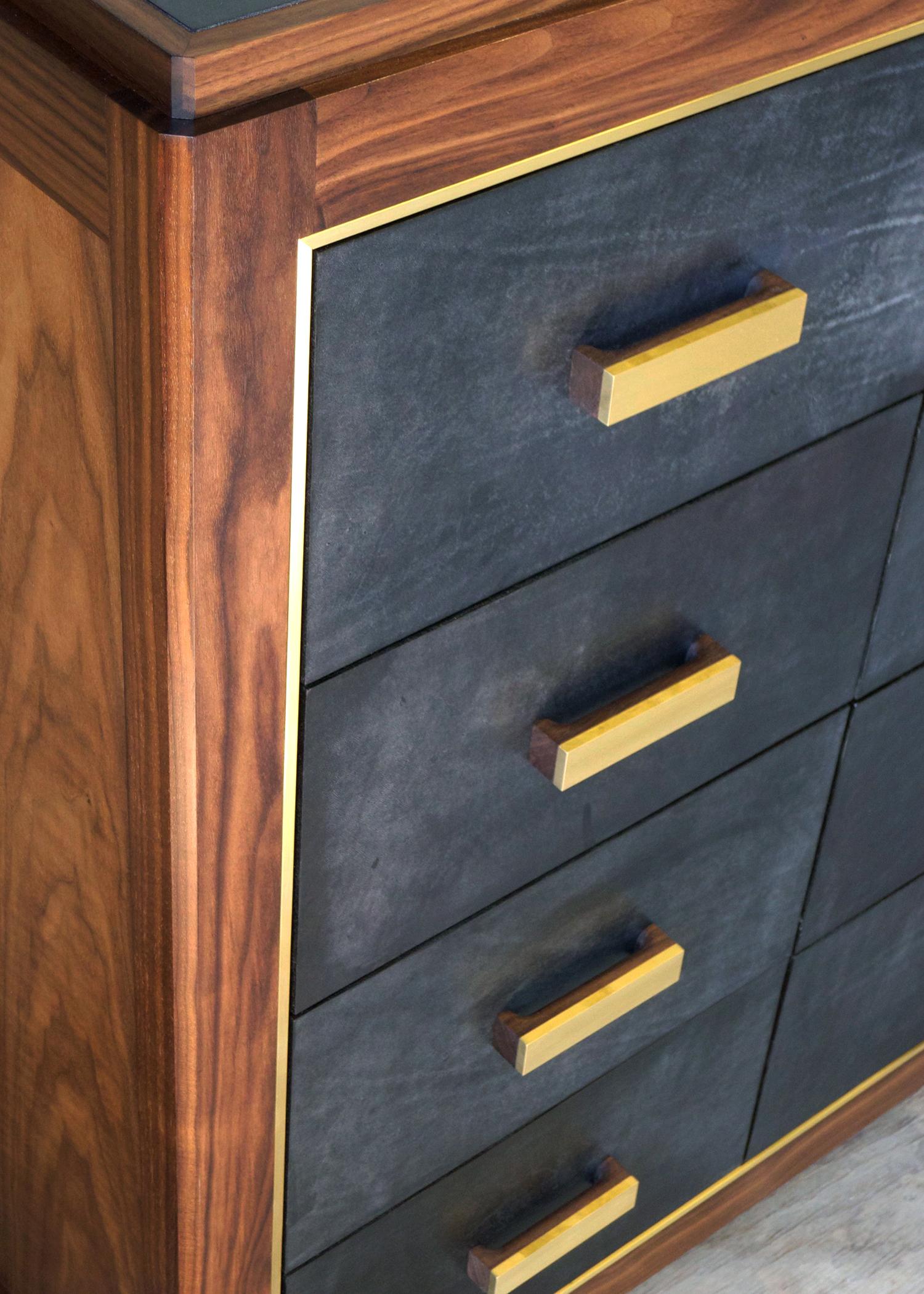 Crafted from rugged saddle leather, the Abuelo collection imitates the streamlined lines of a midcentury piece, while the luxuriousness and richness of its materials create a look all it’s own. Solid walnut-construction houses the brass framing of