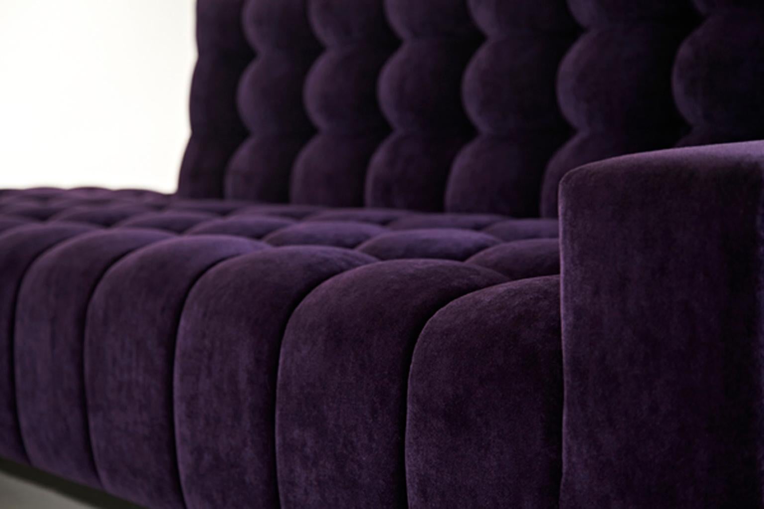 Asymmetrical contours of the Mini Abyss Sofa allow your eyes to roam to and from each of its unique ends. The horizon of the sofa is reminiscent of a casual lounge which melds into a cavernous nook where you can sit back and relax. The upholstered