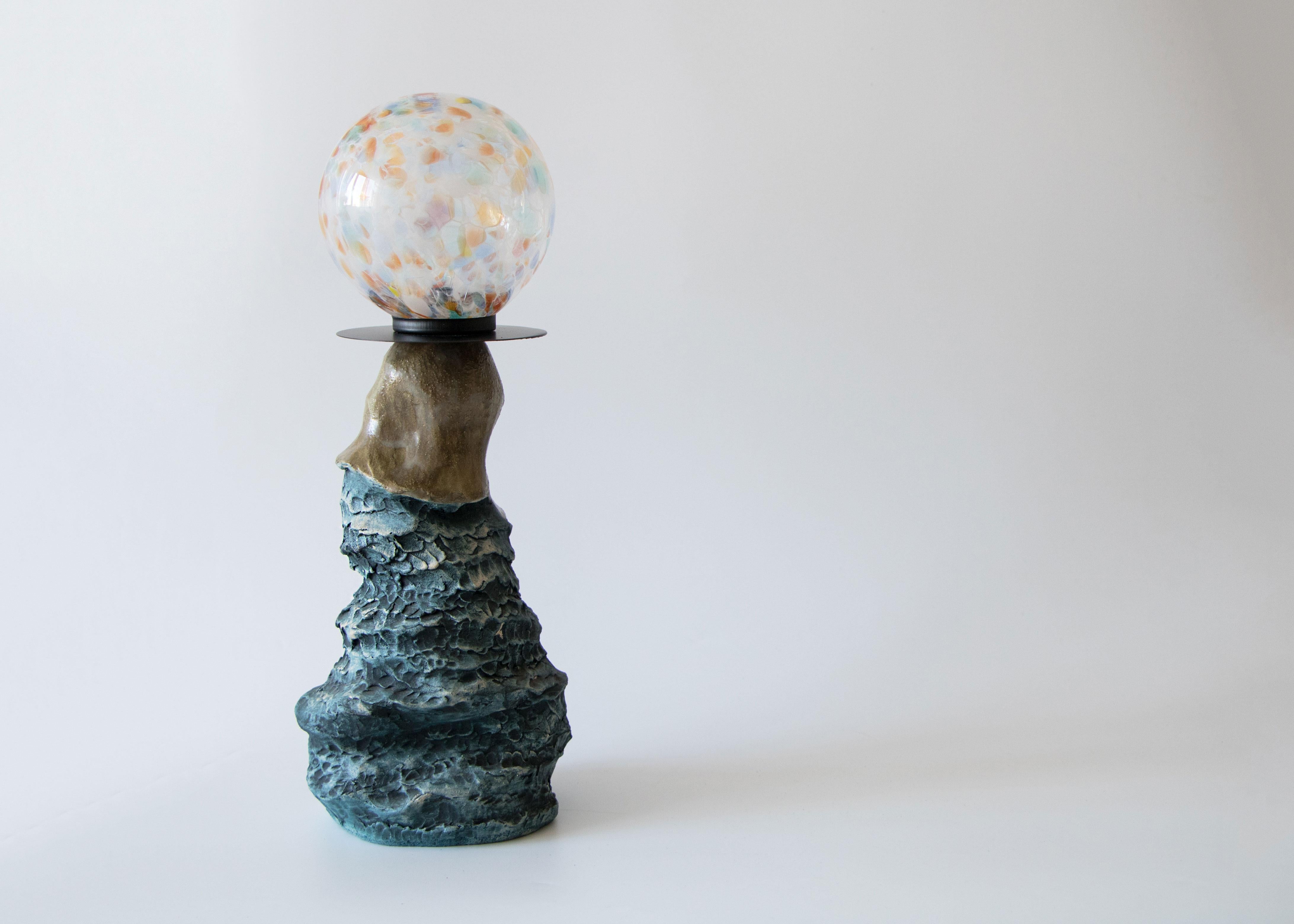 Abyss No 2 table lamp by Ceren Gurkan
Dimensions: D 15 x W 10 x H 35 cm
Materials: Ceramic, handblown glass.

All our lamps can be wired according to each country. If sold to the USA it will be wired for the USA for instance.

Ceren Gurkan is an