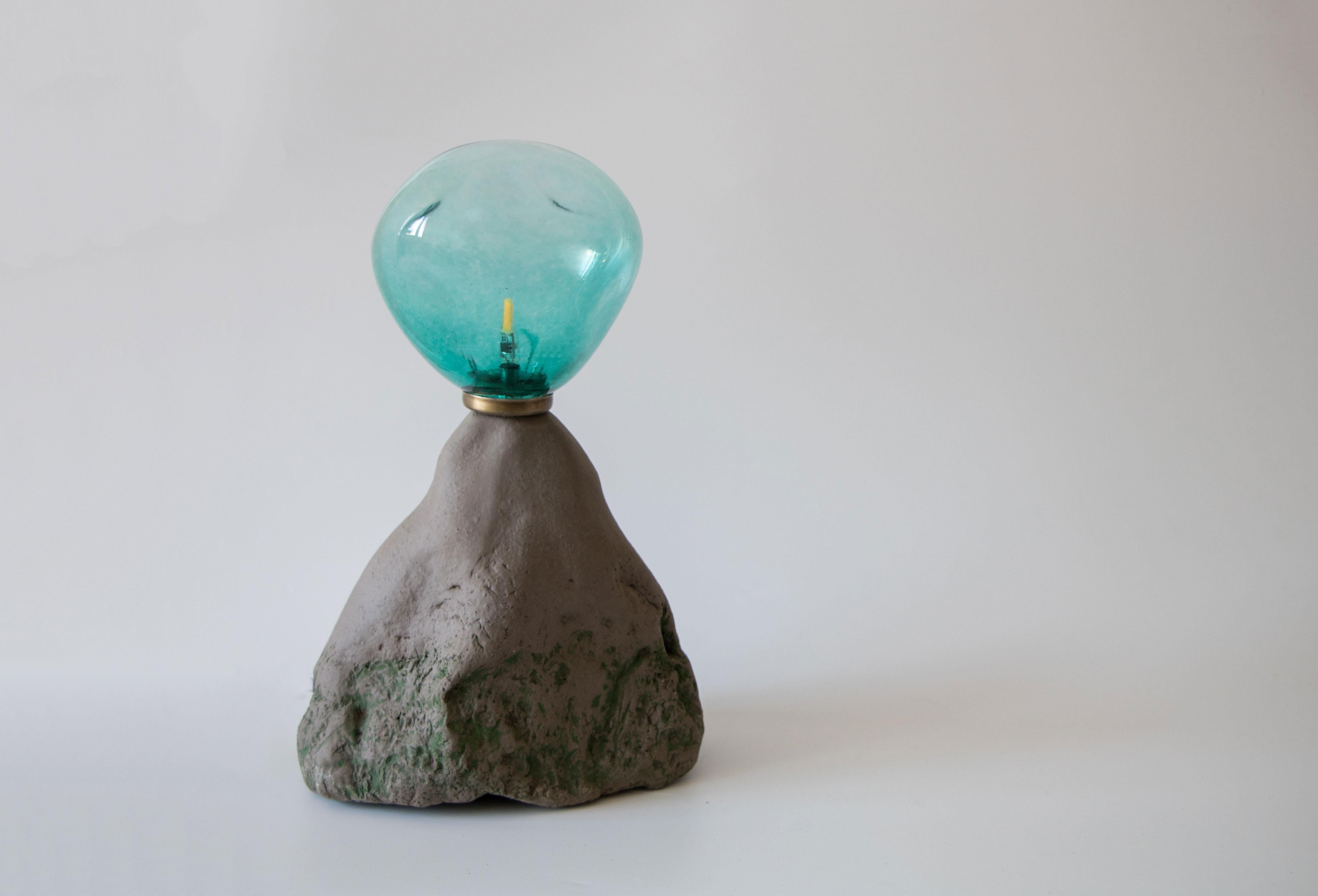 Abyss No 7 table lamp by Ceren Gurkan
Dimensions: D15 x W20 x H28 cm
Materials: Stoneware, handblown glass.

All our lamps can be wired according to each country. If sold to the USA it will be wired for the USA for instance.

Ceren Gurkan is