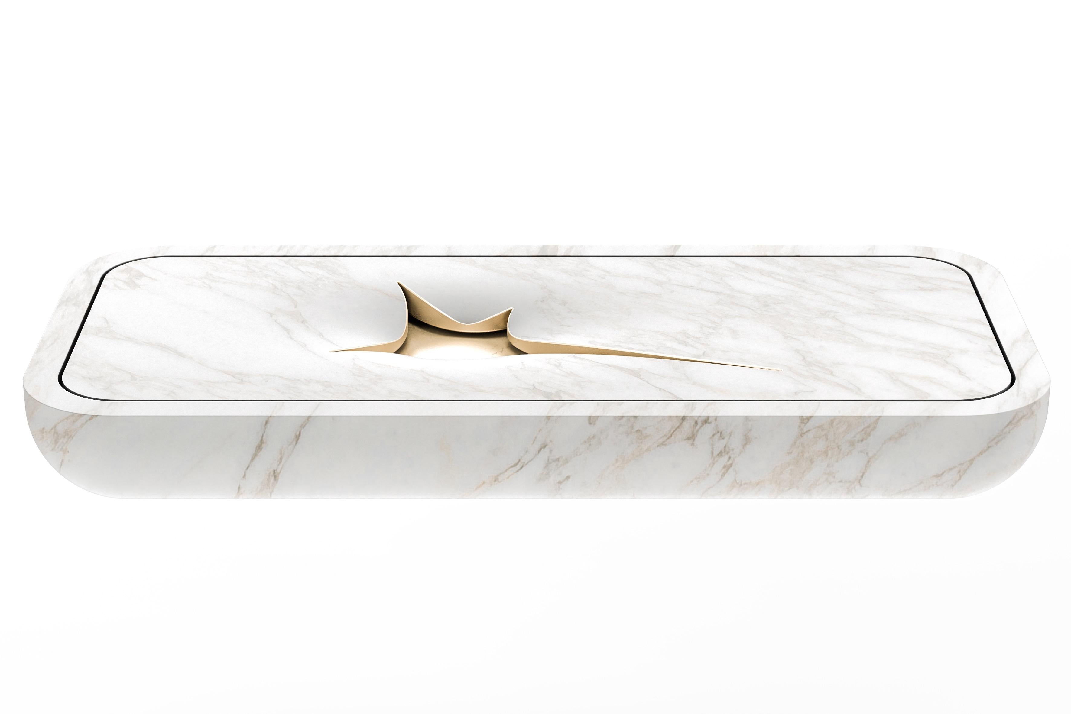 Abyss washbasin by Marmi Serafini
Materials: Calcatta Oro marble, gold leaf.
Dimensions: D 55 x W 120 x H 15 cm
Available in other marbles.

An iconic bathroom sink with a simple and minimal style characterized by a defined yet irregular cut that
