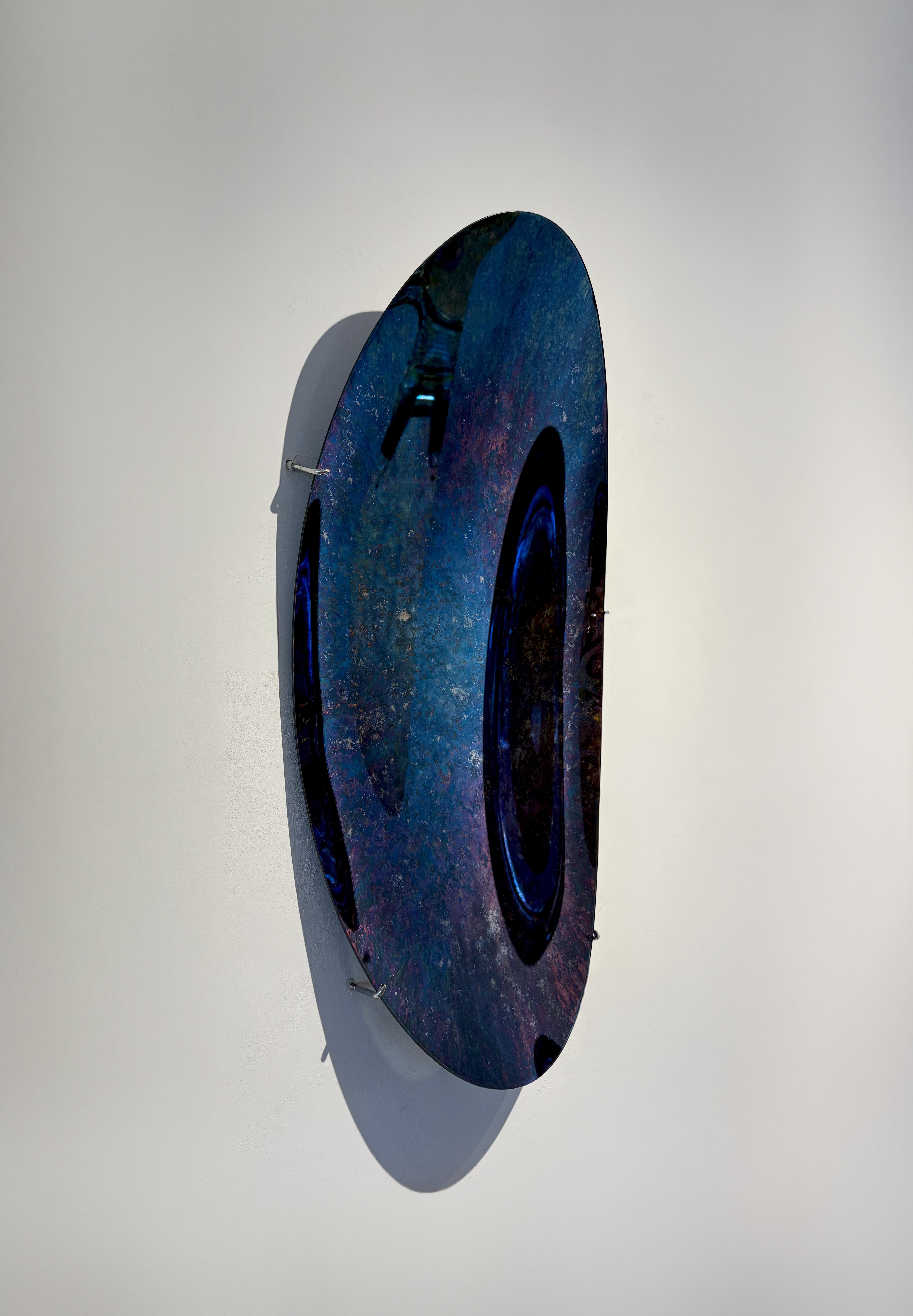 Concave Oxidized Mirror.
130 x 65 cm  Depth: 10 cm  Thickness: 4 mm 
Colour: Multicolor  Hanger: Brass

The ABYSS Collection of curved mirrors merges our own interpretation of mirroring techniques with a contemporary approach. Through experiments