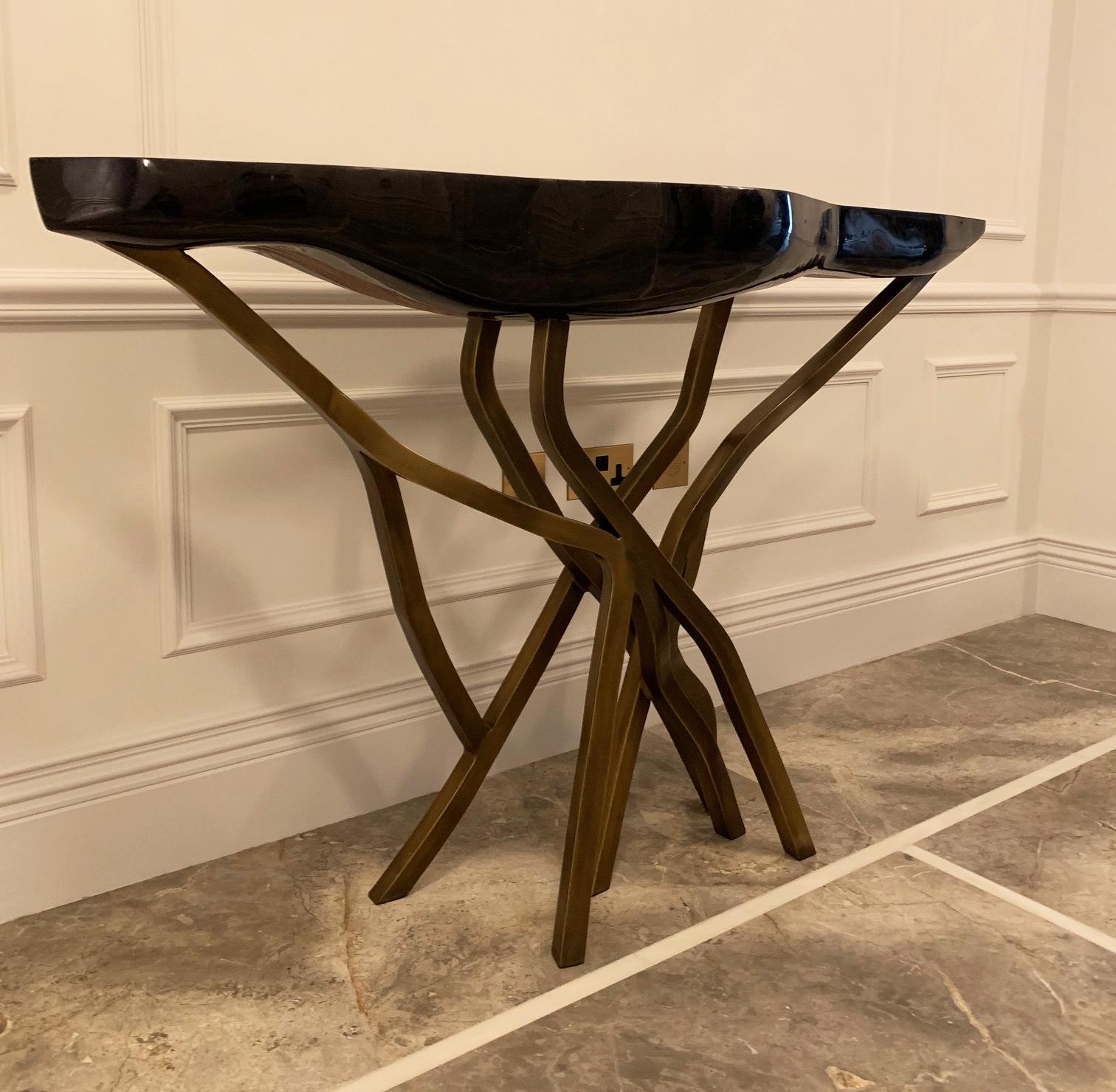A French 'contemporary design' sculptural console table...

This stunning piece of functional art is designed and manufactured by the incomparable R&Y Augousti, France. The 'Acacia' console table features an organically shaped top; hand-crafted from