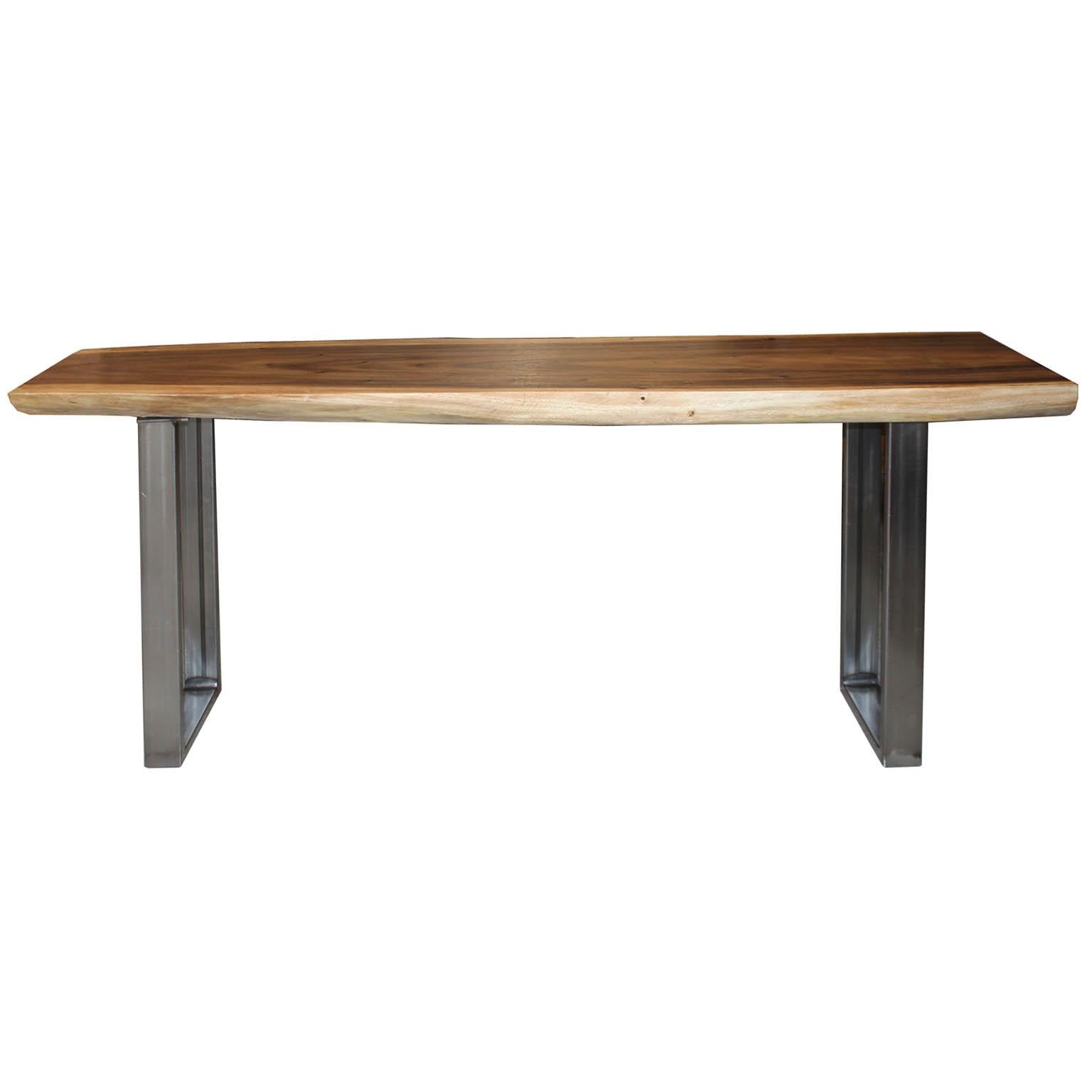 Live edge acacia wood console table on metal legs. This piece was made in Indonesia.