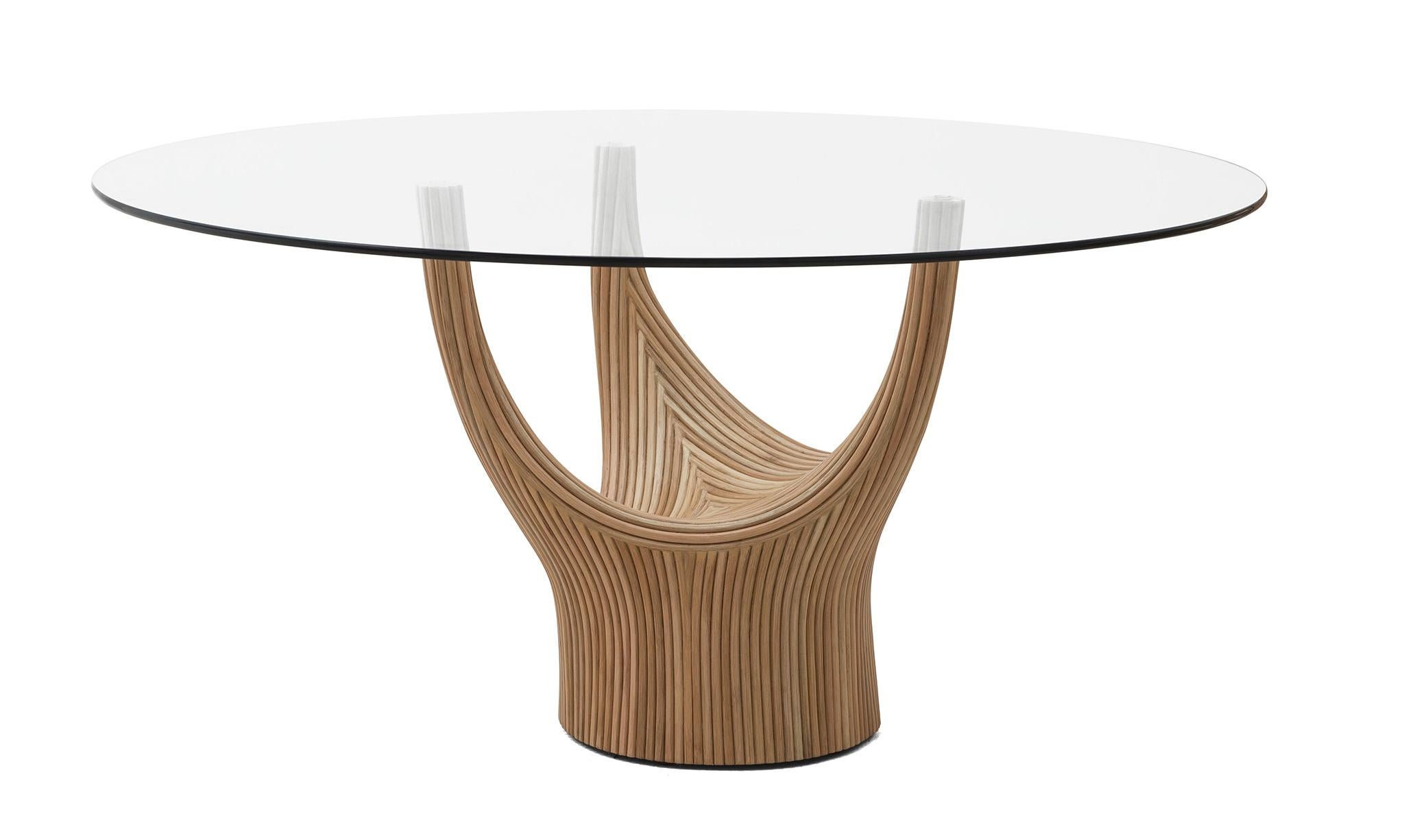 Dining table by Kenneth Cobonpue
Materials: Rattan, steel, glass. Whitewash top, natural base.
Dimensions: 150 x 58.5 x H 74 cm

Inspired by the ancient baobab, the table collection is made of rattan poles fastened together to create sculptural