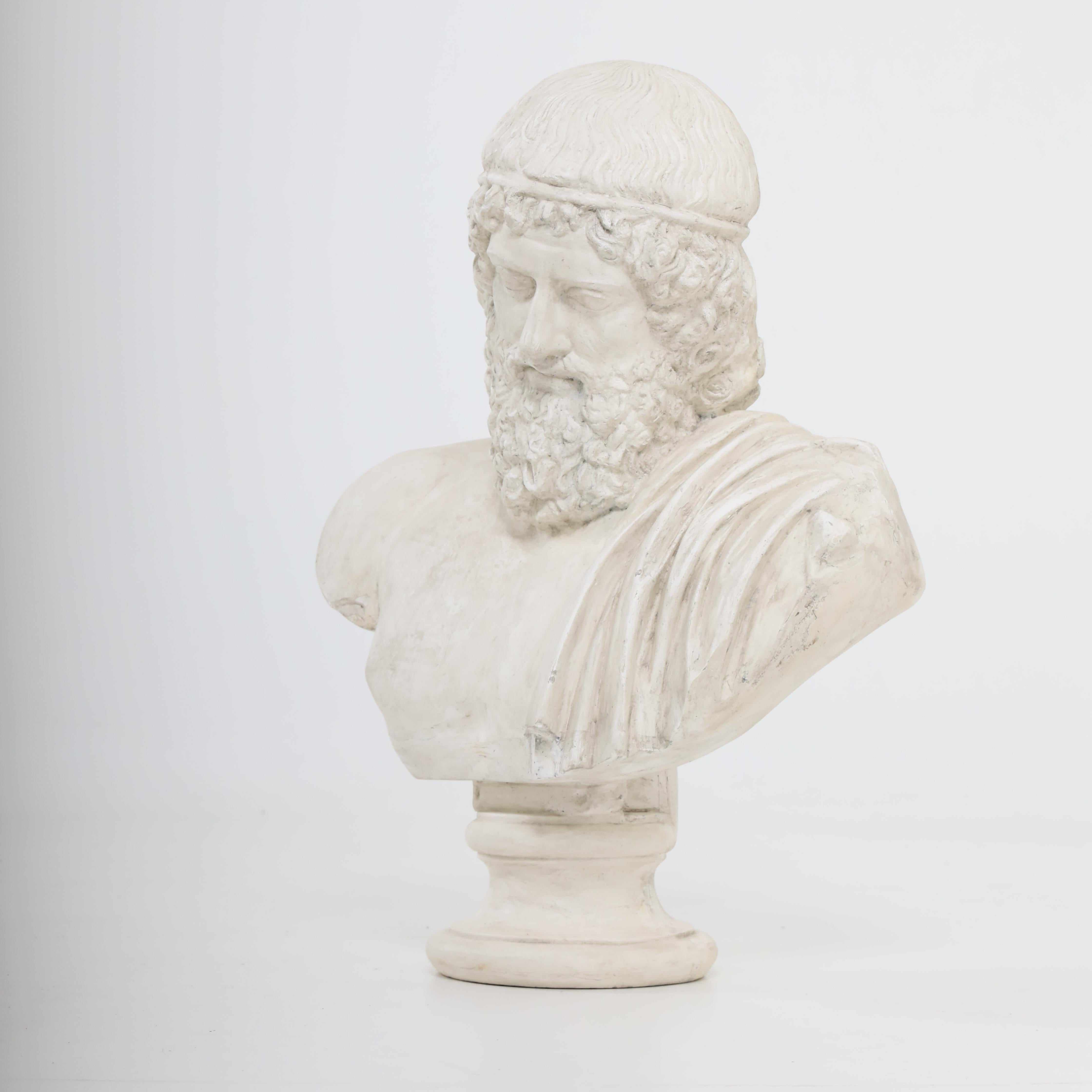 Plaster bust of an ancient, bearded philosopher on a round stand. France 20th century.