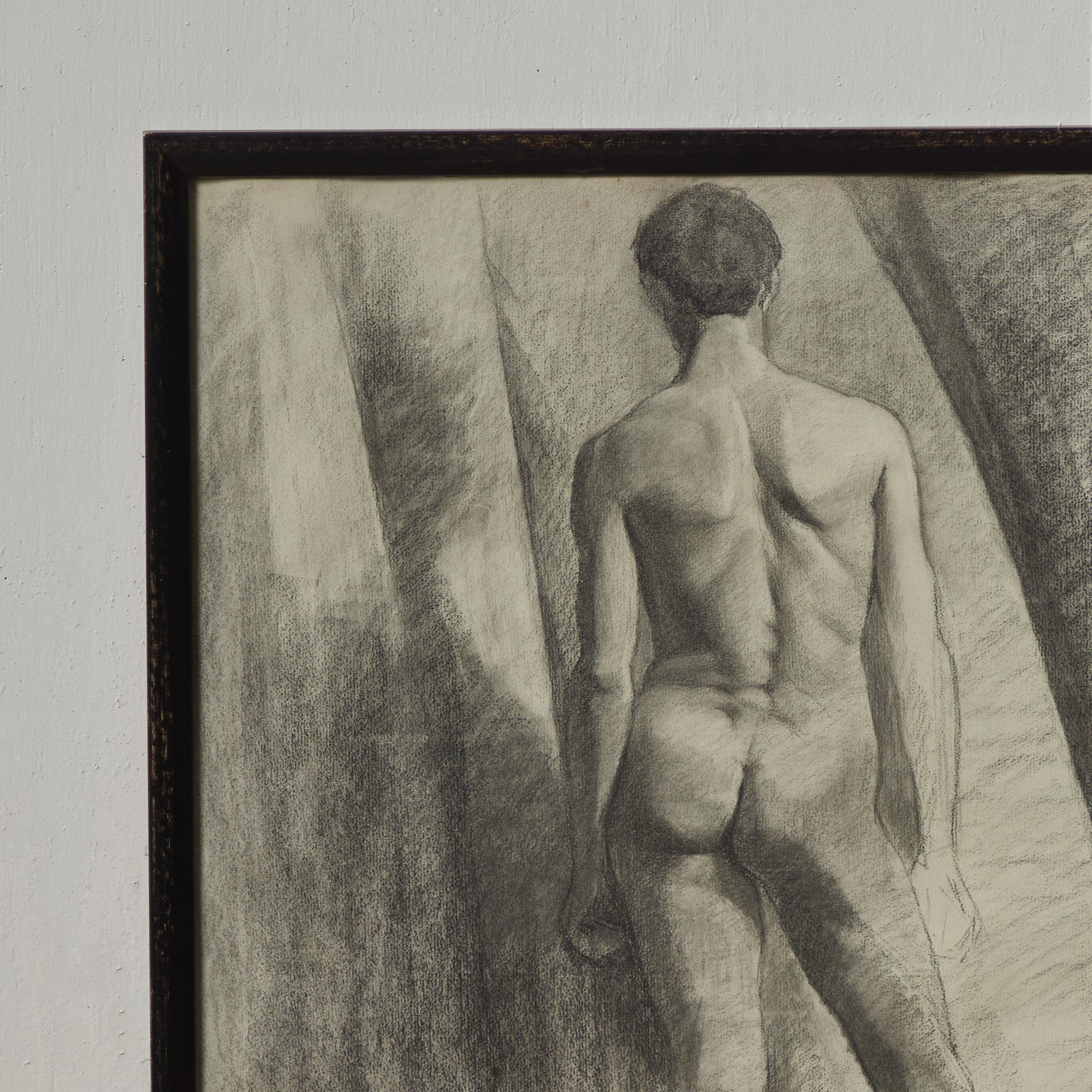 Turn of the century French academic charcoal drawing of standing nude figure, as seen from behind. With its contemplative investigation of volumetric proportioning, the piece has whispers of a proto-Cubist spirit. 

France, circa