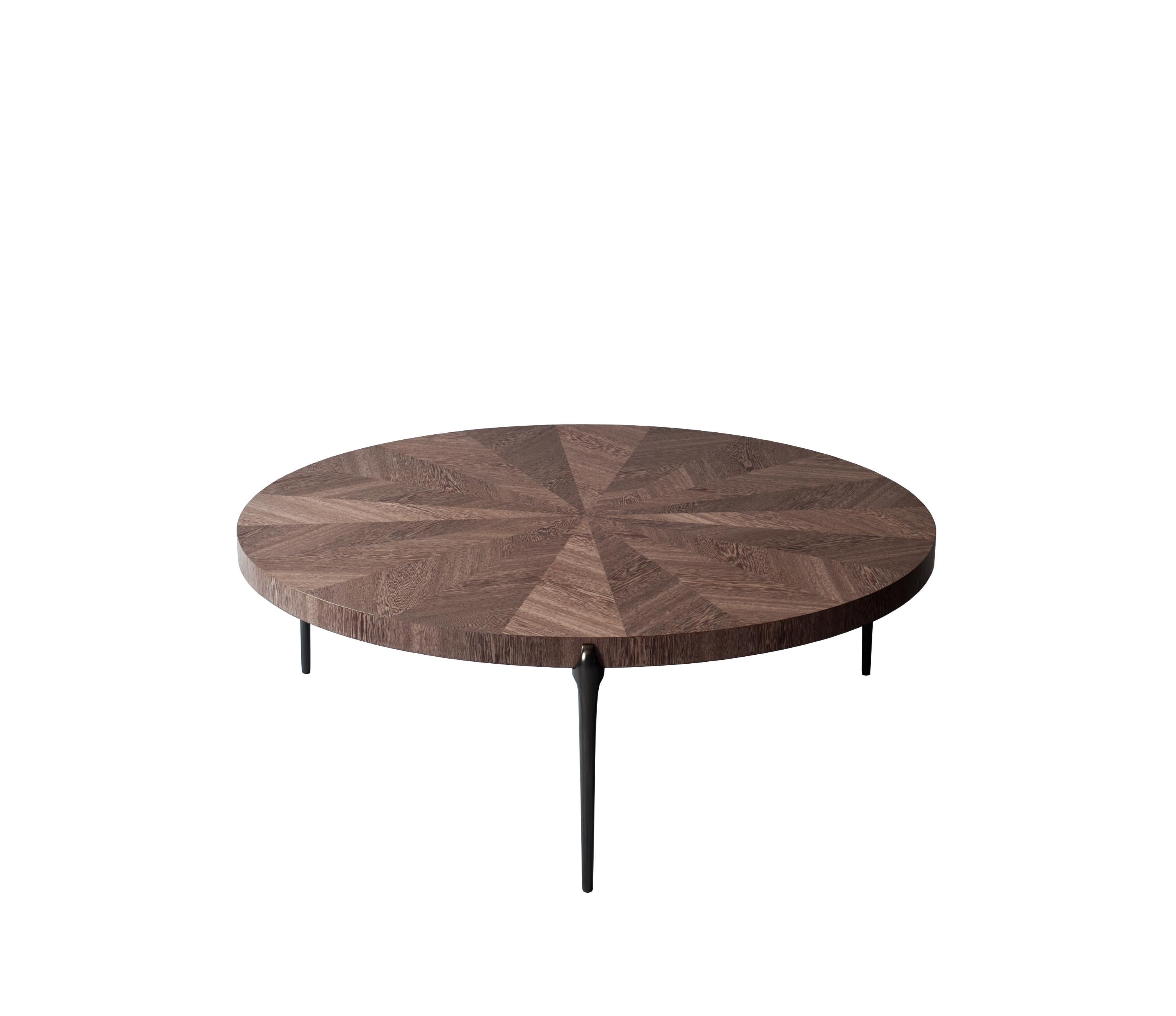 Acantha coffee table by DeMuro Das 
Dimensions: W 120 x D 120 x H 41.1 cm
Materials: Matte Sucupira (Dyed) Tabletop
 Solid Bronze (Grey) - Satin legs

Dimensions and finishes can be customized

DeMuro Das is an international design firm and