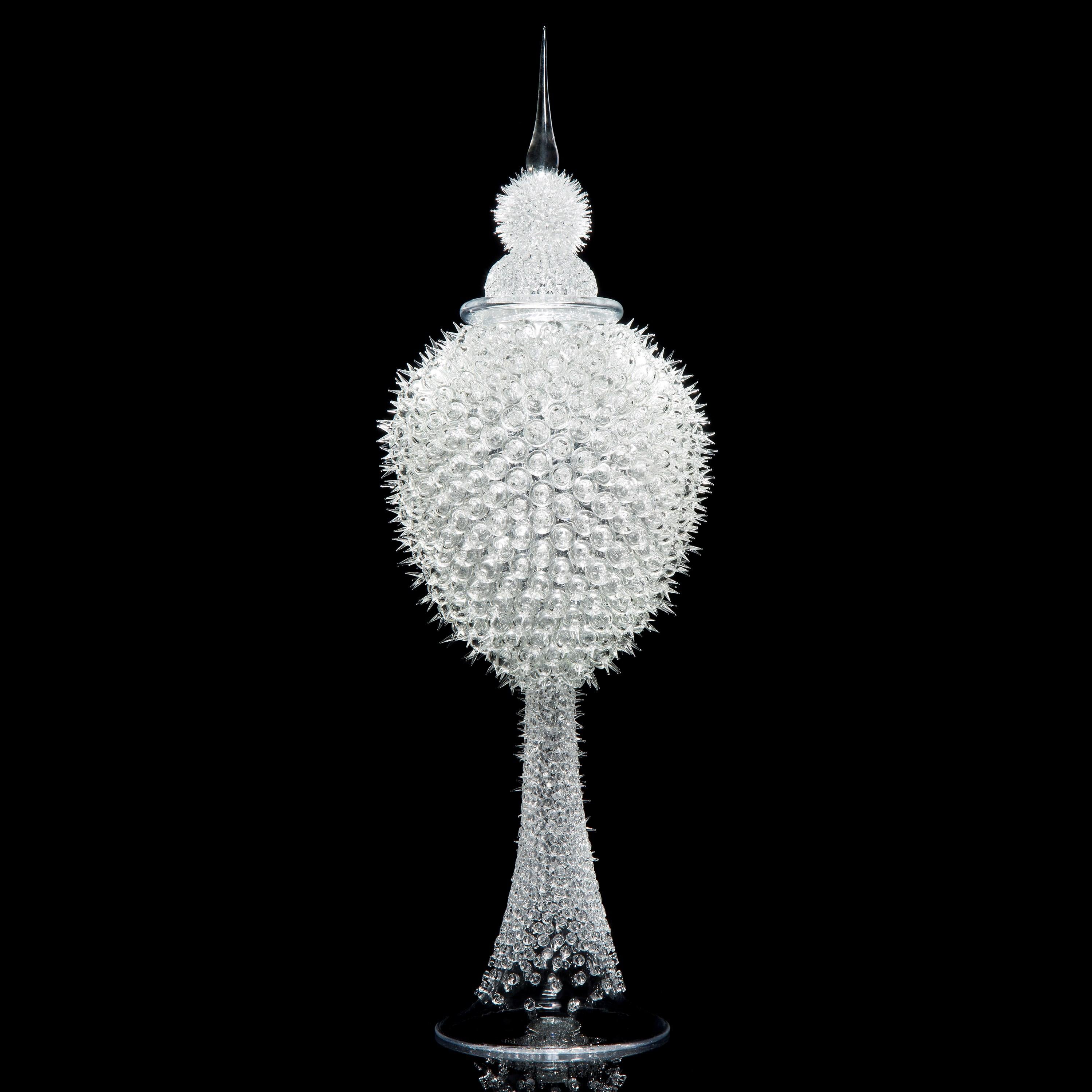 'Acanthus Jar' is a unique clear glass sculptural jar by British glass artist James Lethbridge. Blown glass with the outer layer covered in flame worked decoration and adornment. With removable decorative glass stopper.

Initially following a