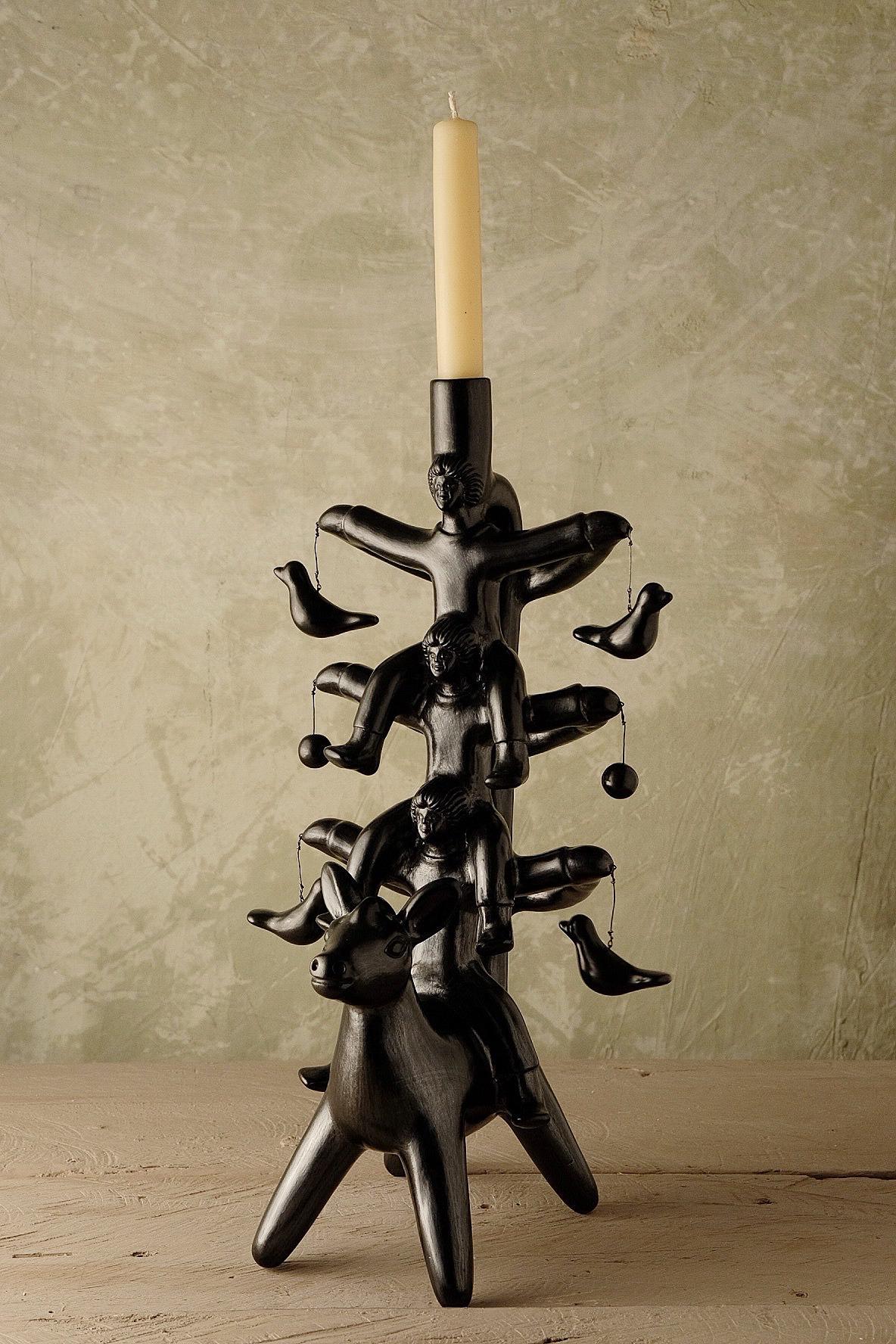 Acatlán candleholder by Onora
Dimensions: W 20 x D 15 x H 40 cm
Materials: Clay

Available in black, white and taupe Hand sculpted clay, covered with a mineral based slip and burnished using a quartz stone. The “Circo Collection” is a