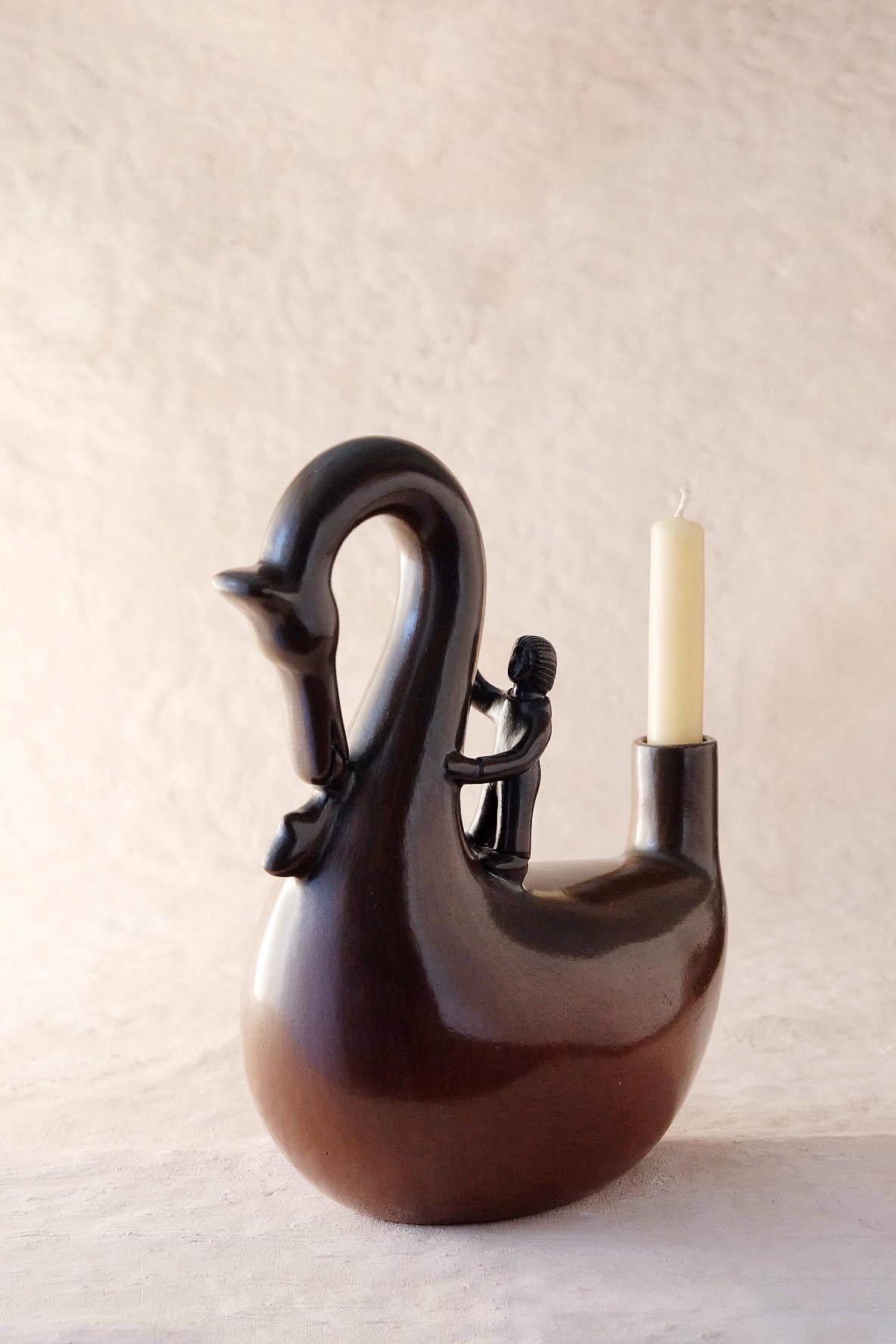 Acatlán Tototl Candleholder by Onora
Dimensions: W 25 x D 12 x H 28 cm
Materials: Clay, Quartz stone

Hand sculpted clay, covered with a mineral based slip and burnished using a quartz stone. 

We are a Mexican brand dedicated to the creation