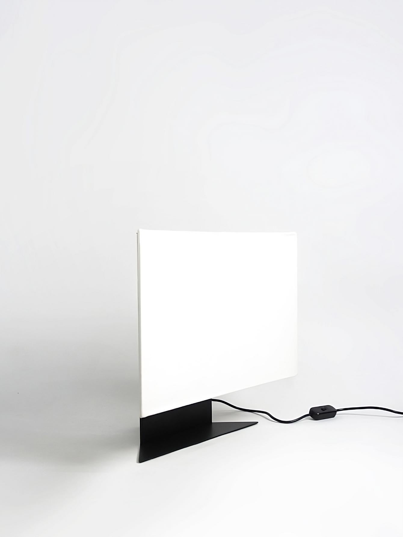 The Accademia lamp, designed by Cini Boeri in 1978, is a small-scale version of the popular table lamp created for Artemide. This lamp is an impressive example of Boeri's minimalist approach to design, with its elegant and refined aesthetics