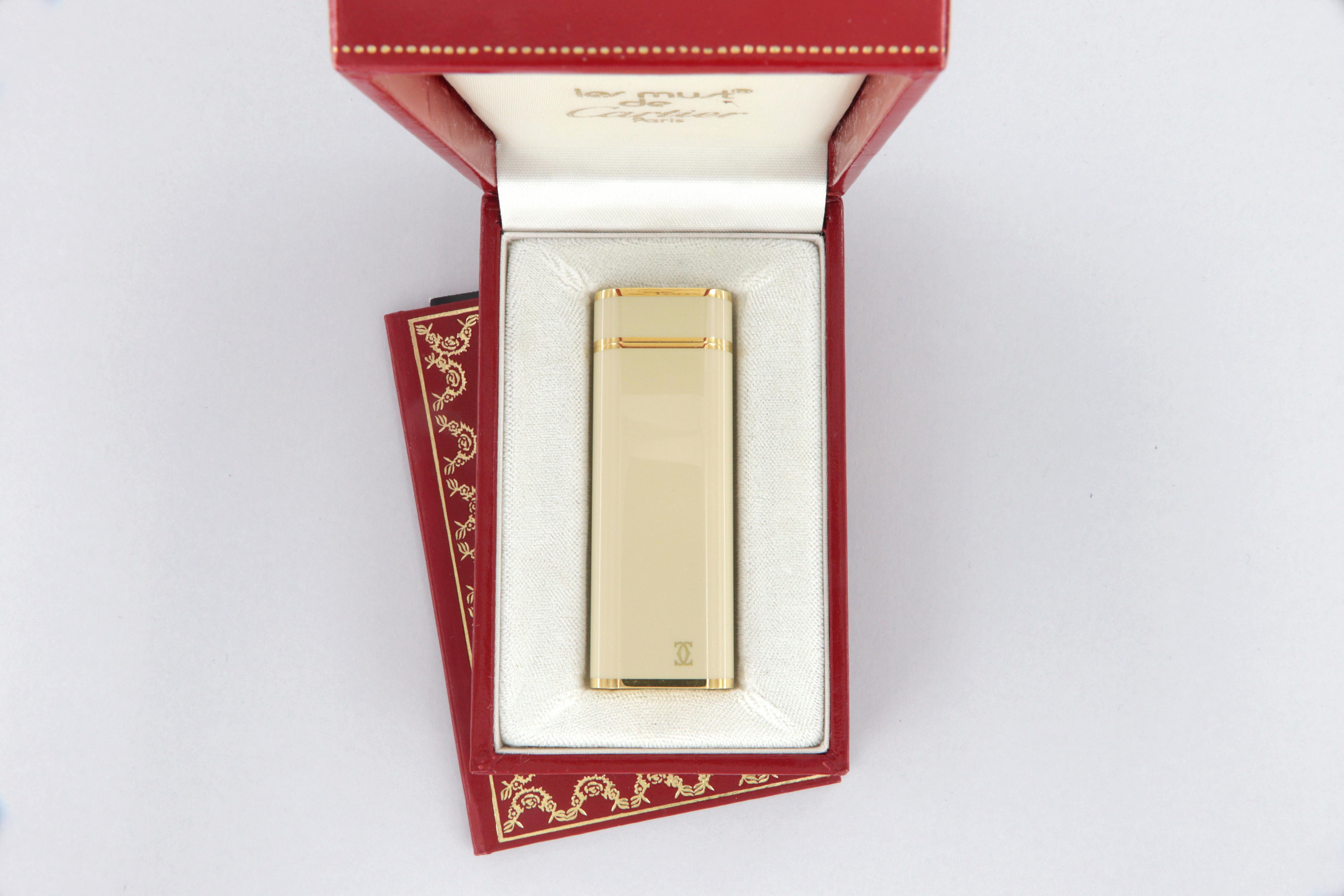 Les Must de Cartier oval gold-plated and ivory lacquer lighter 6