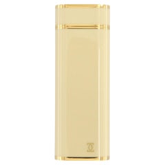Les Must de Cartier oval gold-plated and ivory lacquer lighter