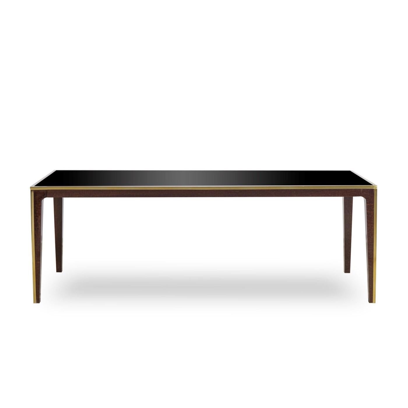 Dining table accent with structure in solid beechwood
with eucalyptus veneer. With smoked tempered glass top.
With stainless steel rim in vintage brass finish on feet and
around the top.