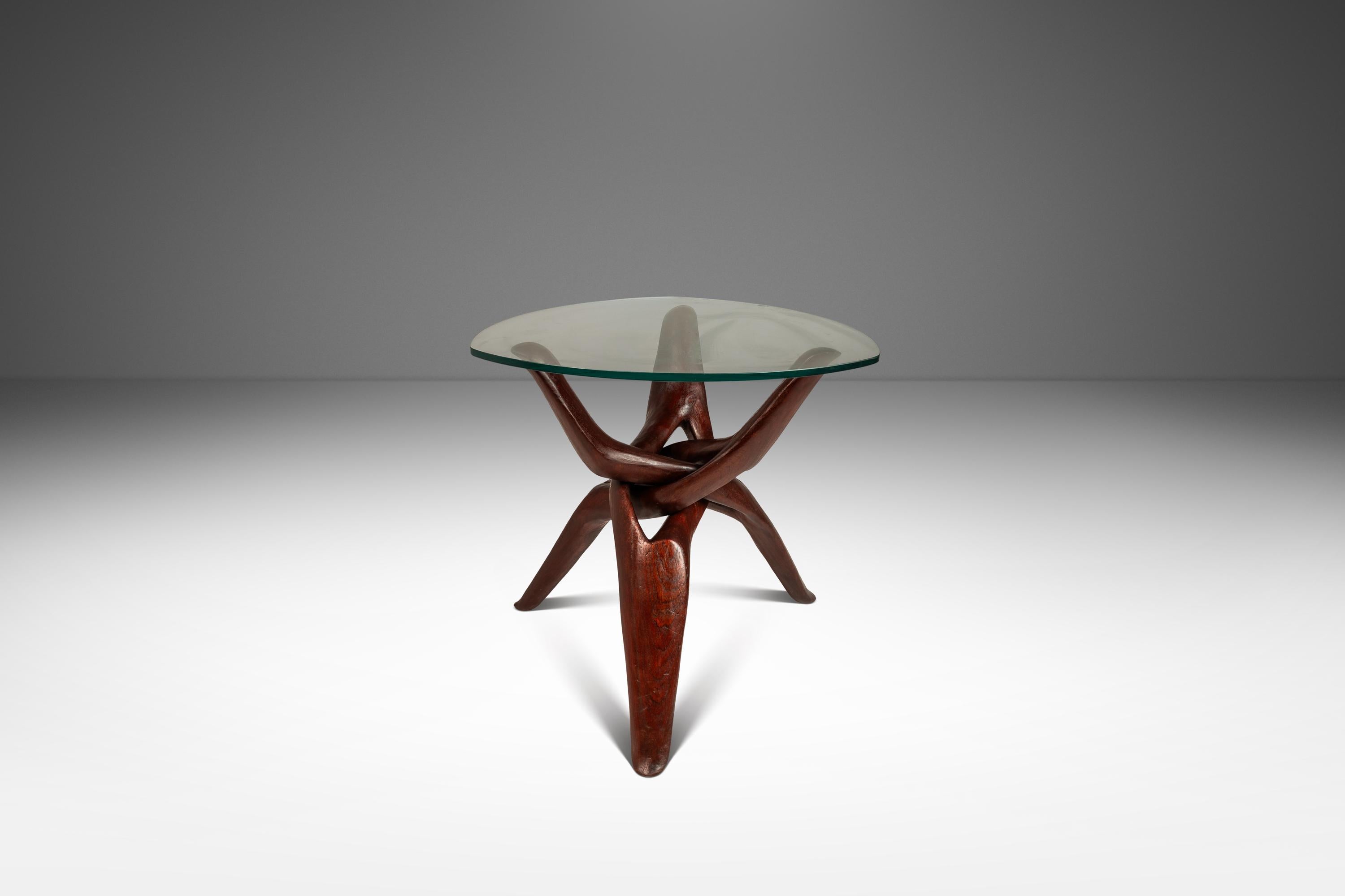 Introducing a truly one-of-a-kind accent table cut from solid slabs of rich mahogany. The tripod design was literally carved by hand to be interlocking without any joinery or hardware demonstrating superb craftsmanship that any discerning eye