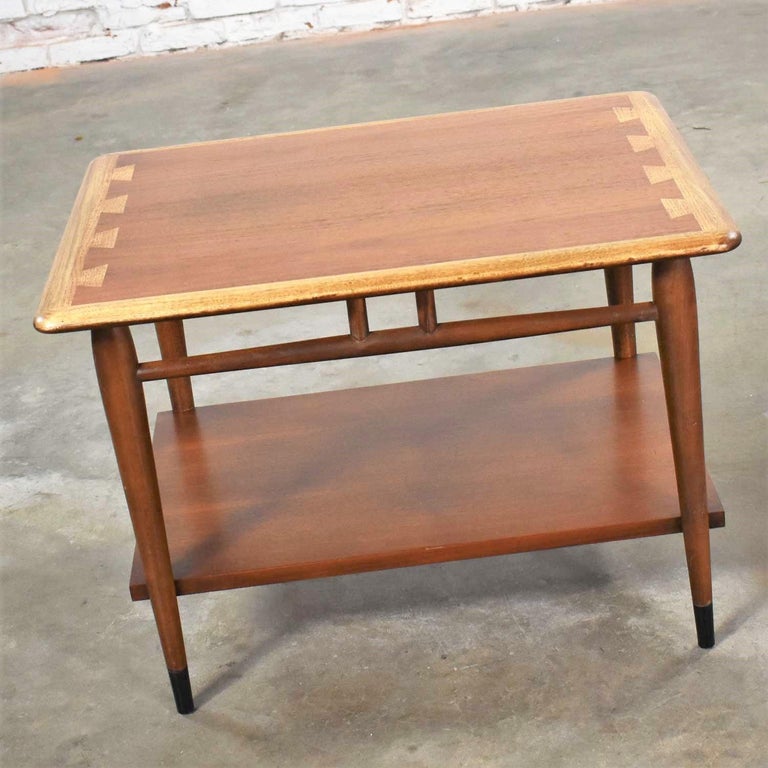 Handsome Lane Acclaim series 900-05 gunstock walnut lamp table, end table, or side table designed by Andre Bus. It is in wonderful vintage condition. The top has been refinished to remove a darkened water ring otherwise finish is original. Please