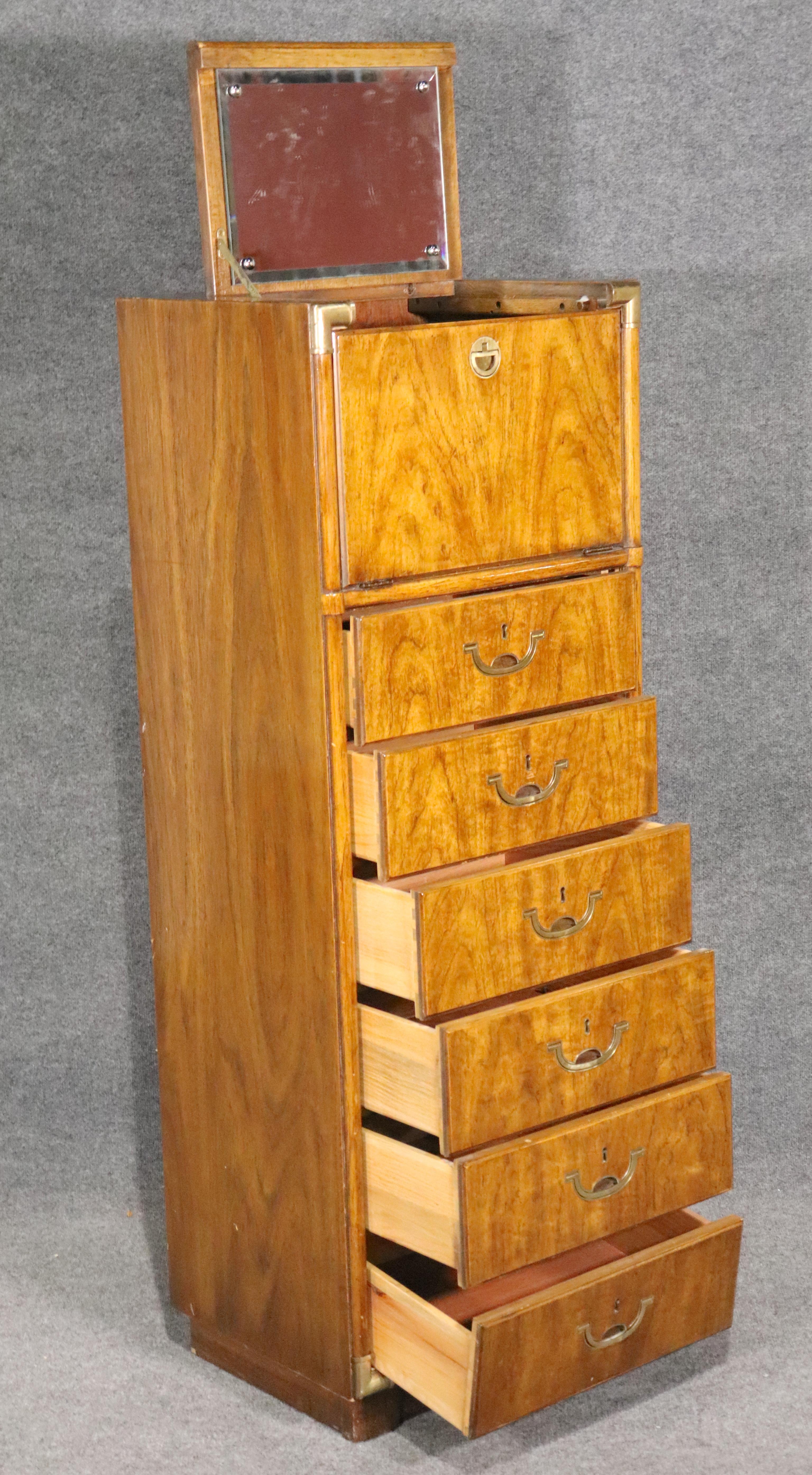 Mid-Century Modern tall chest of drawers with hidden mirror. Designed by Drexel for their Accolade II series. This is a lingerie chest and vanity in one!
Please confirm location.
 