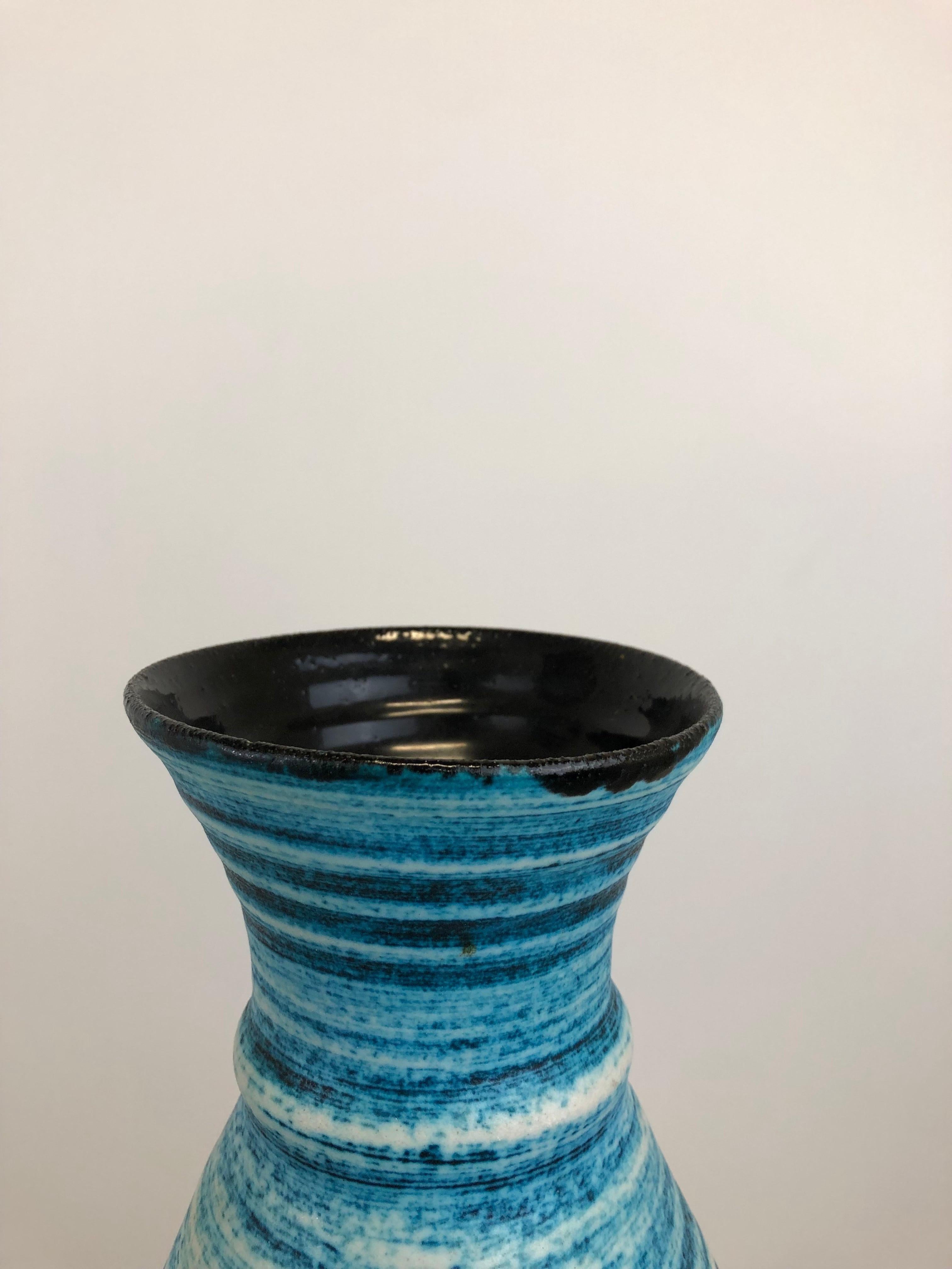 A truly stunning French Accolay gauloise blue ceramic vase dating from around 1960. 

Elegant and simplistic shape. 

The vase is decorated in contrasting matt blue colors with a spiral design and has an incised Accolay signature mark to the