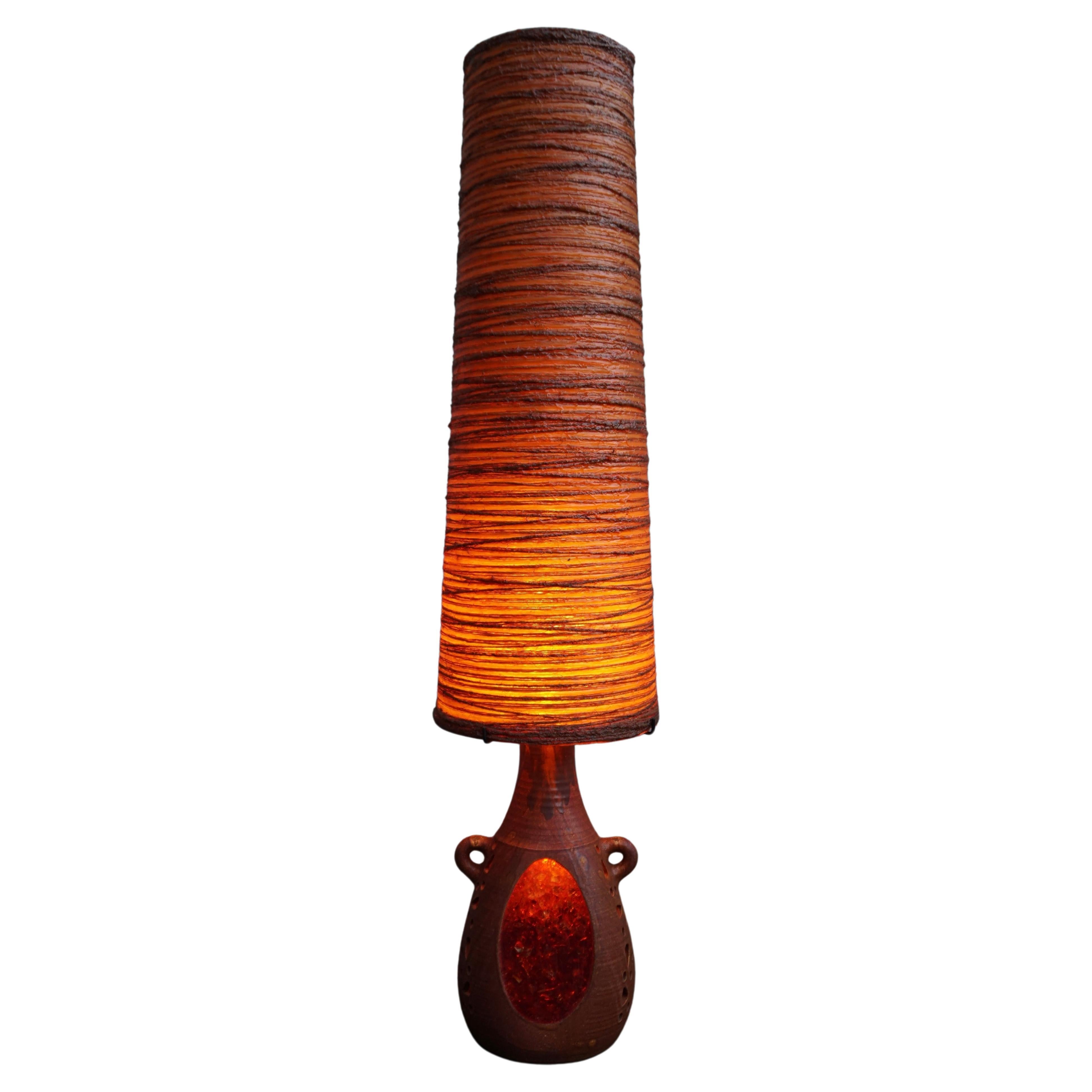 Important double-light accolay lamp. Ceramic base, raffia lampshade encased in resin. 

Shade: height 89 cm, shade bottom diameter 30 cm. 
Total height with shade: 133 cm.